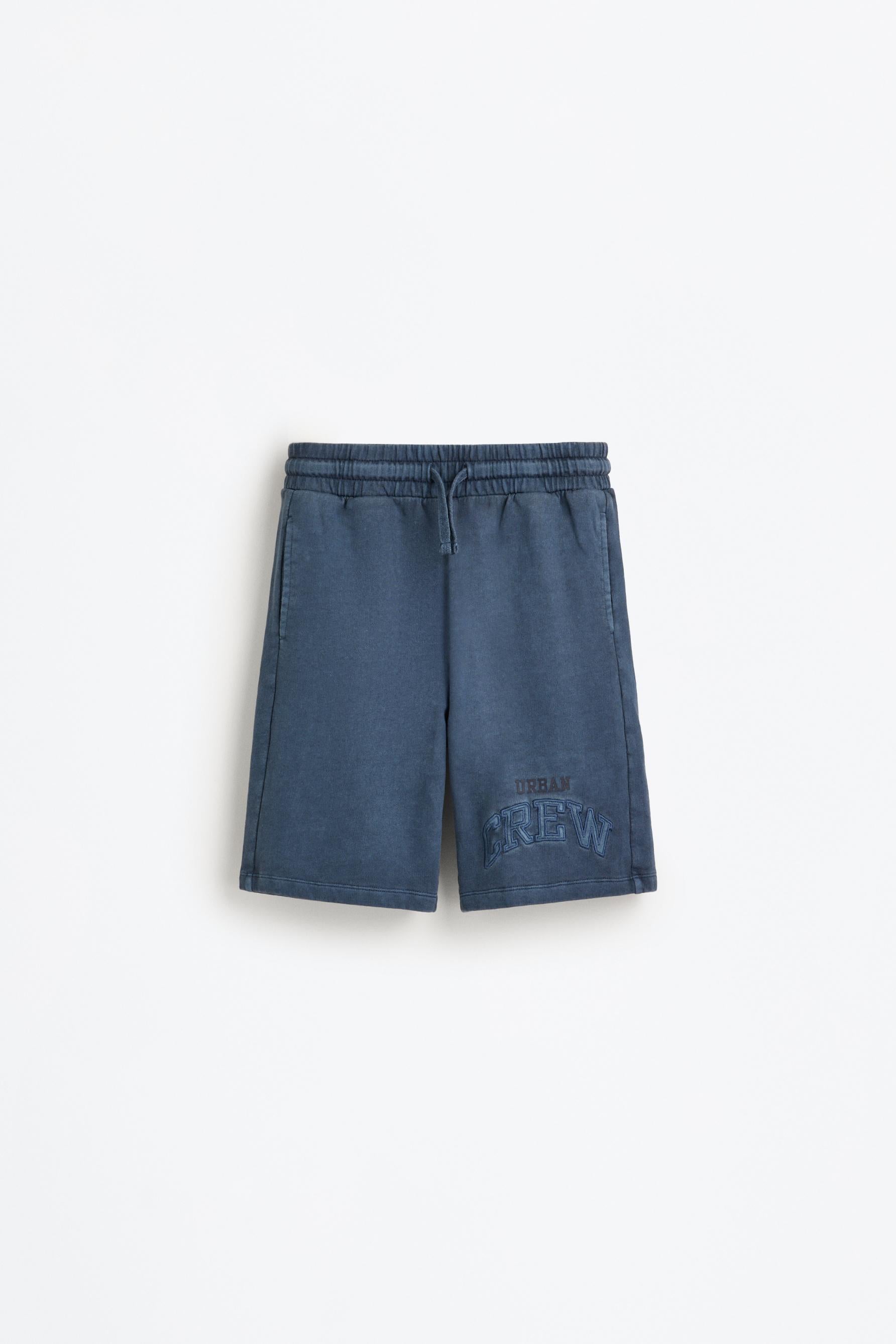 Bermuda shorts with text patches