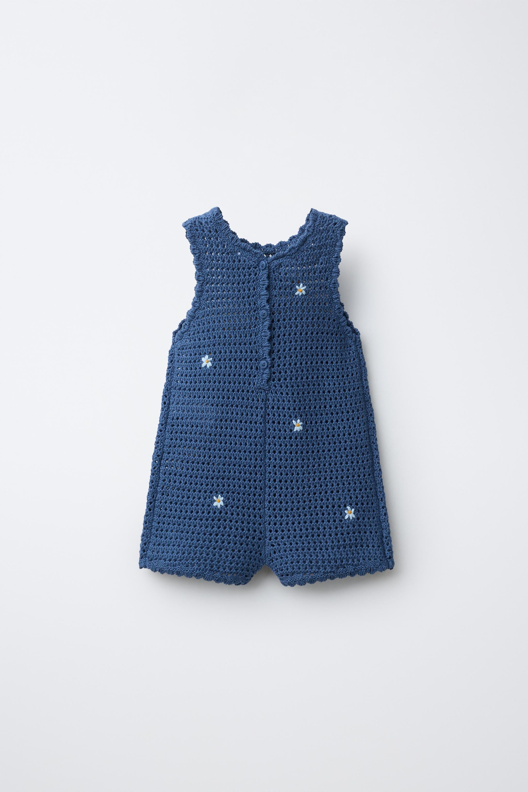 CUTWORK KNIT ROMPER WITH EMBROIDERED FLOWERS