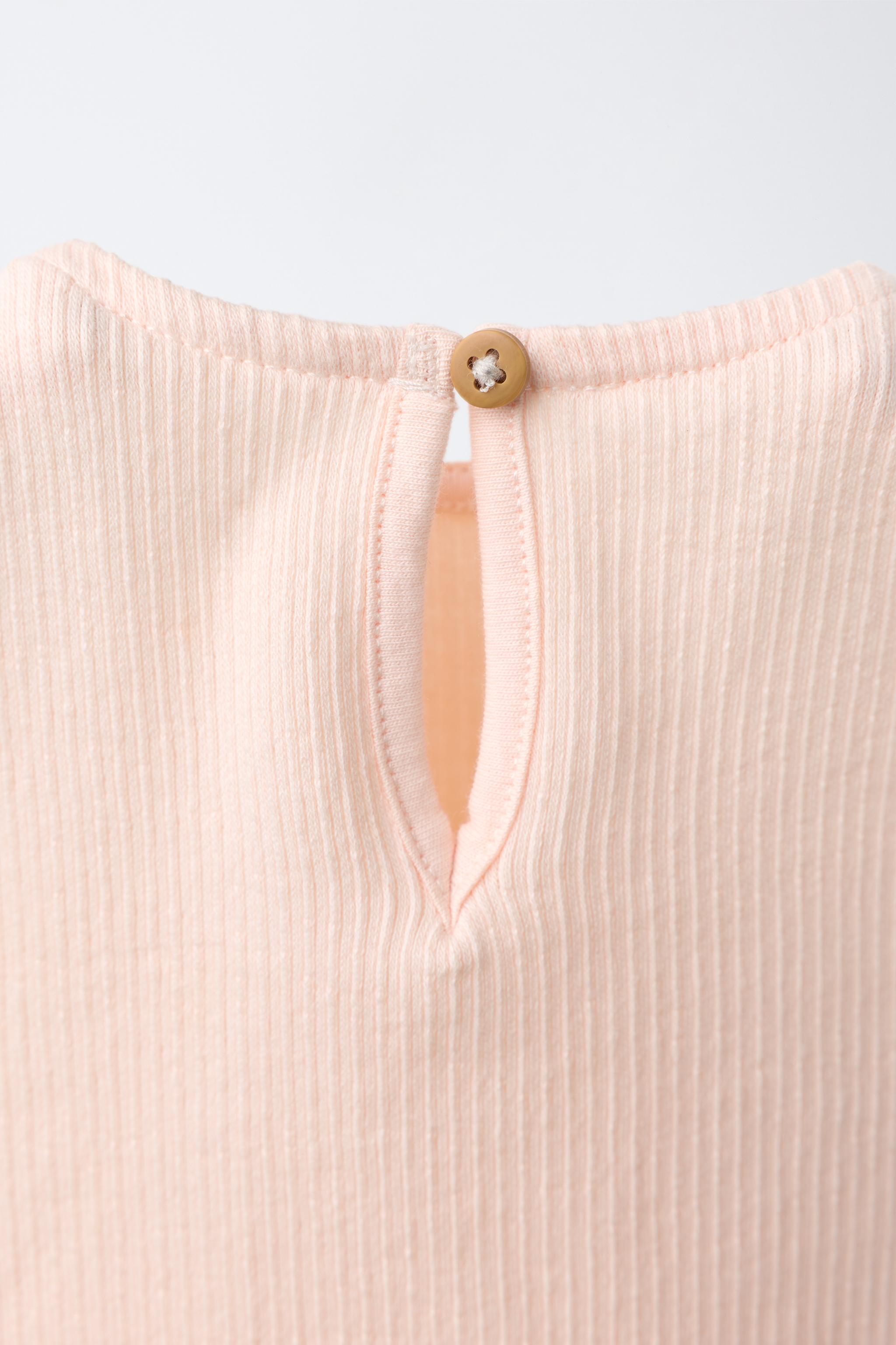 EMBROIDERED SUN RUFFLE BODYSUIT