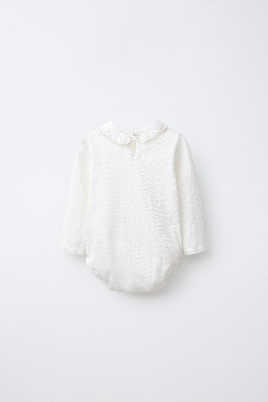 BODYSUIT WITH PETER PAN COLLAR AND SWISS EMBROIDERY