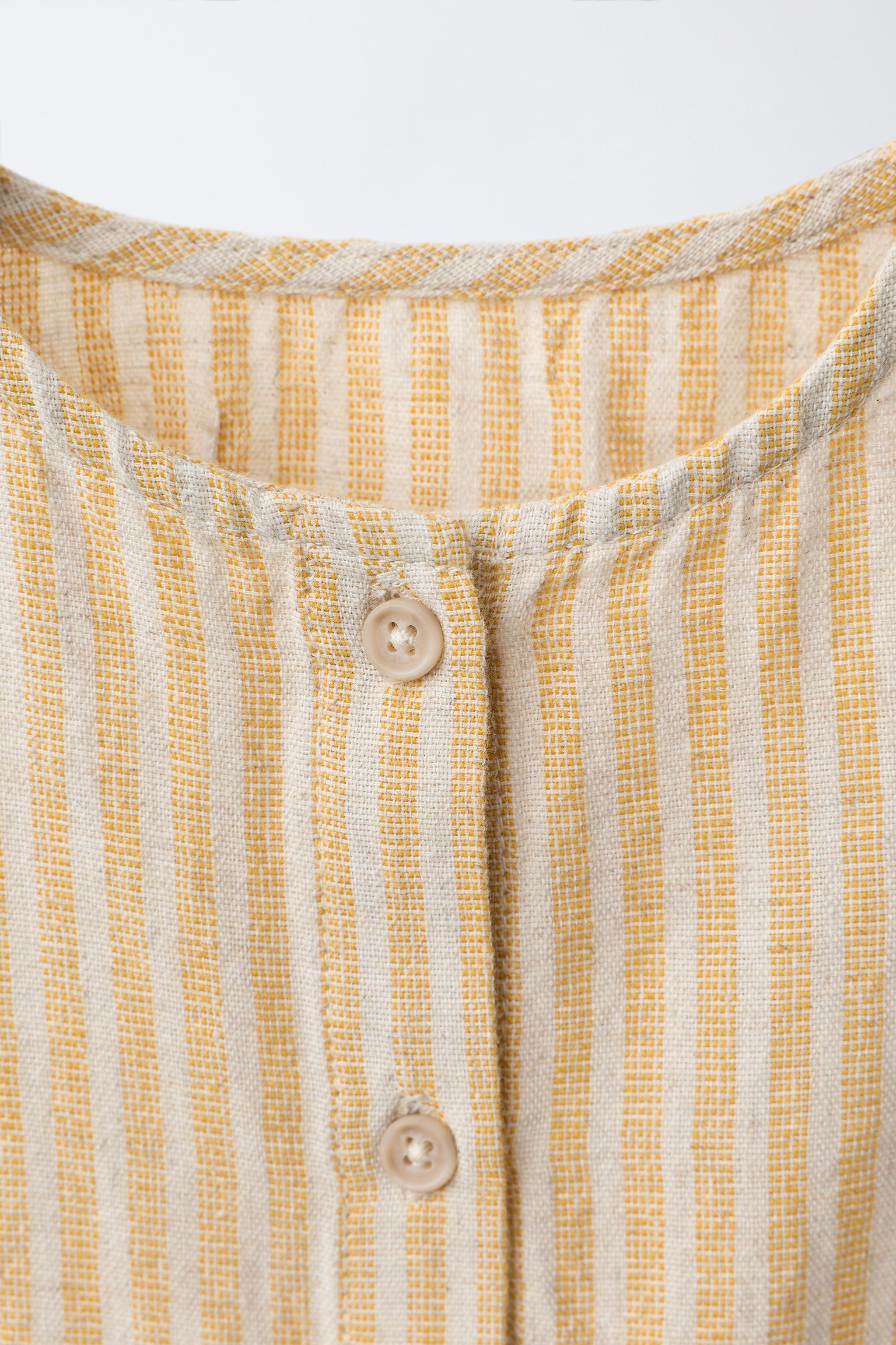 STRIPED COTTON AND LINEN ROMPER