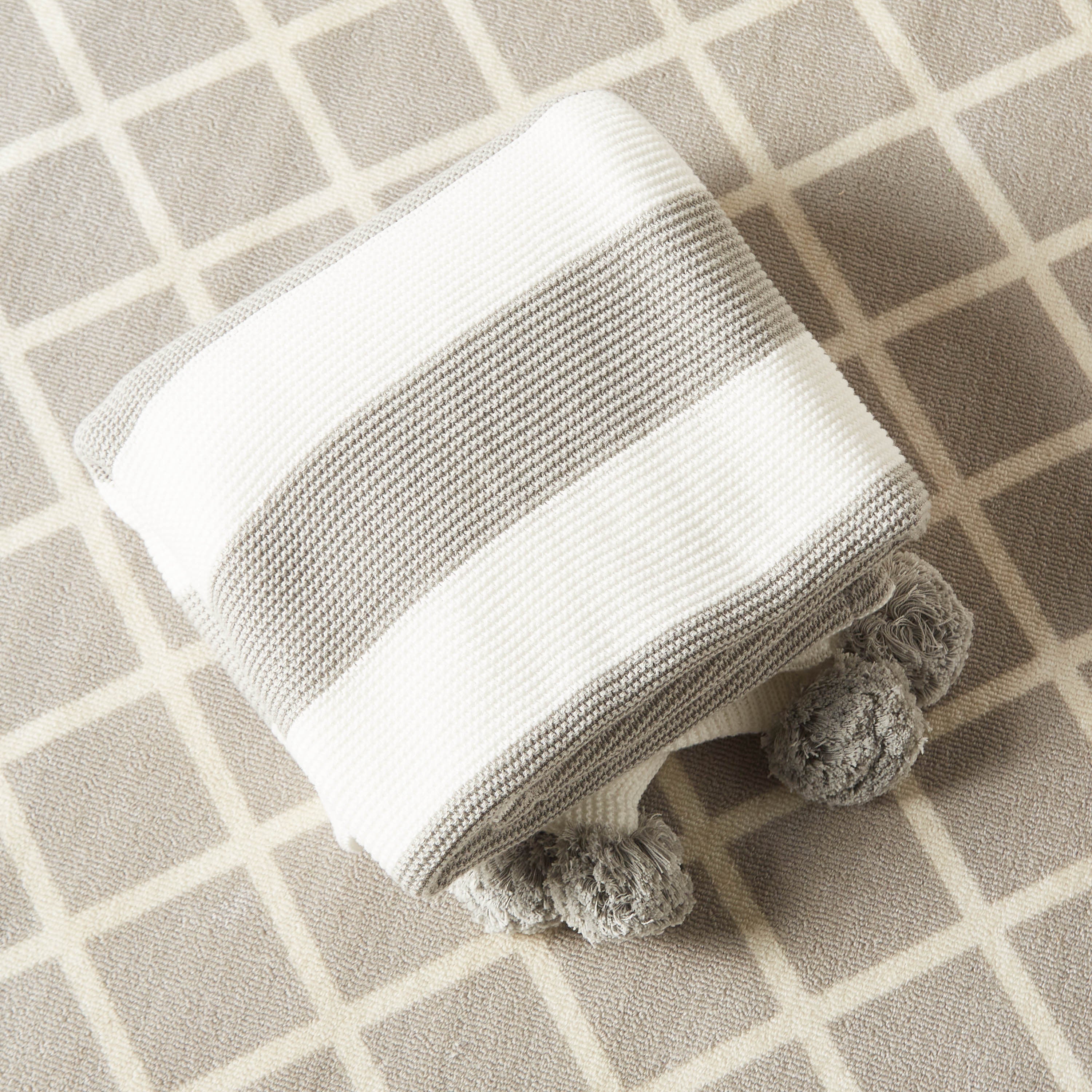 Juniors Striped Knitted Raschel Blanket with Pom Pom Detail - 100x80 cms