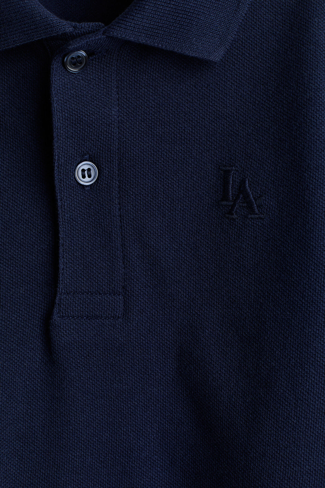 Embroidered-motif piqué polo shirt