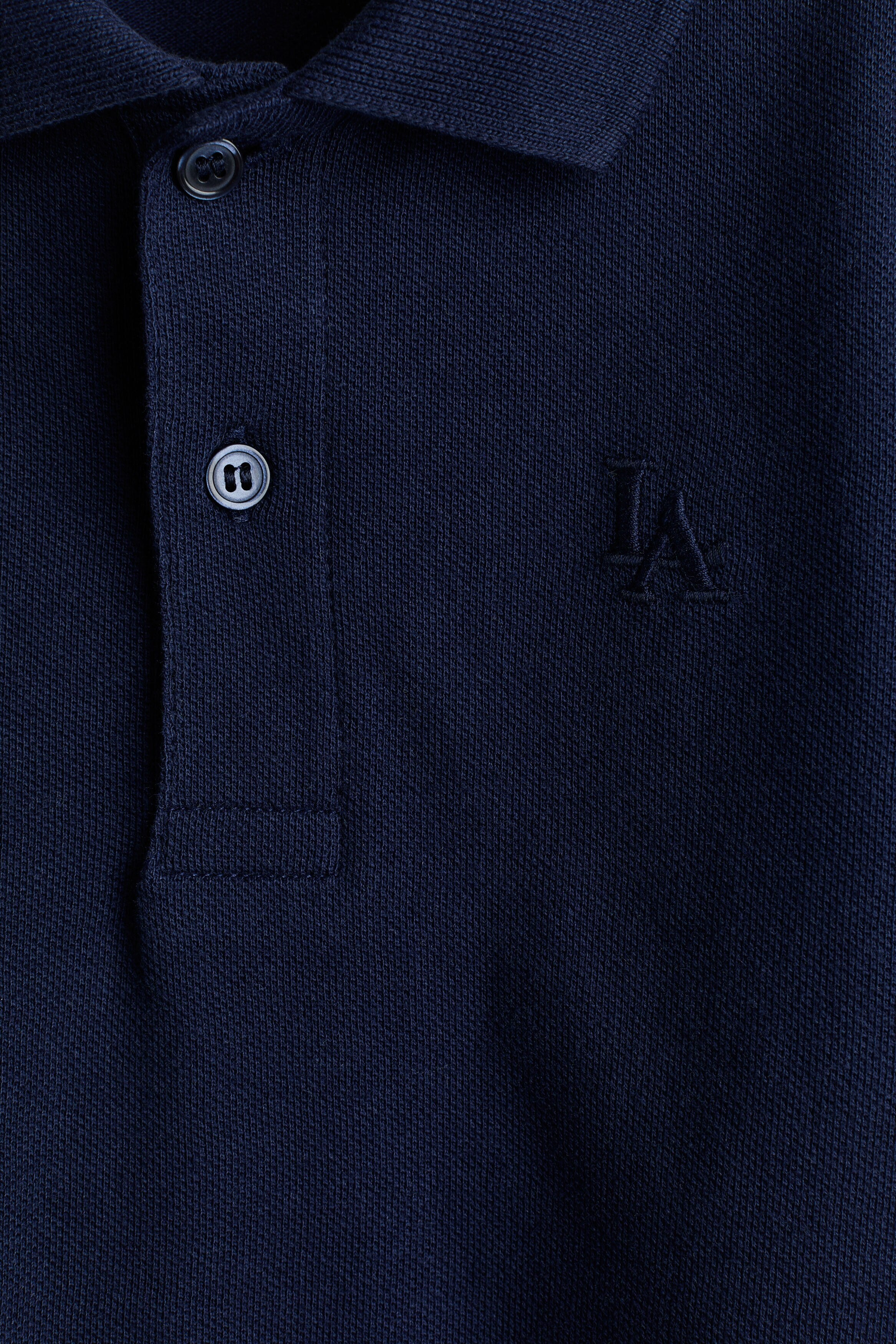 Embroidered-motif piqué polo shirt