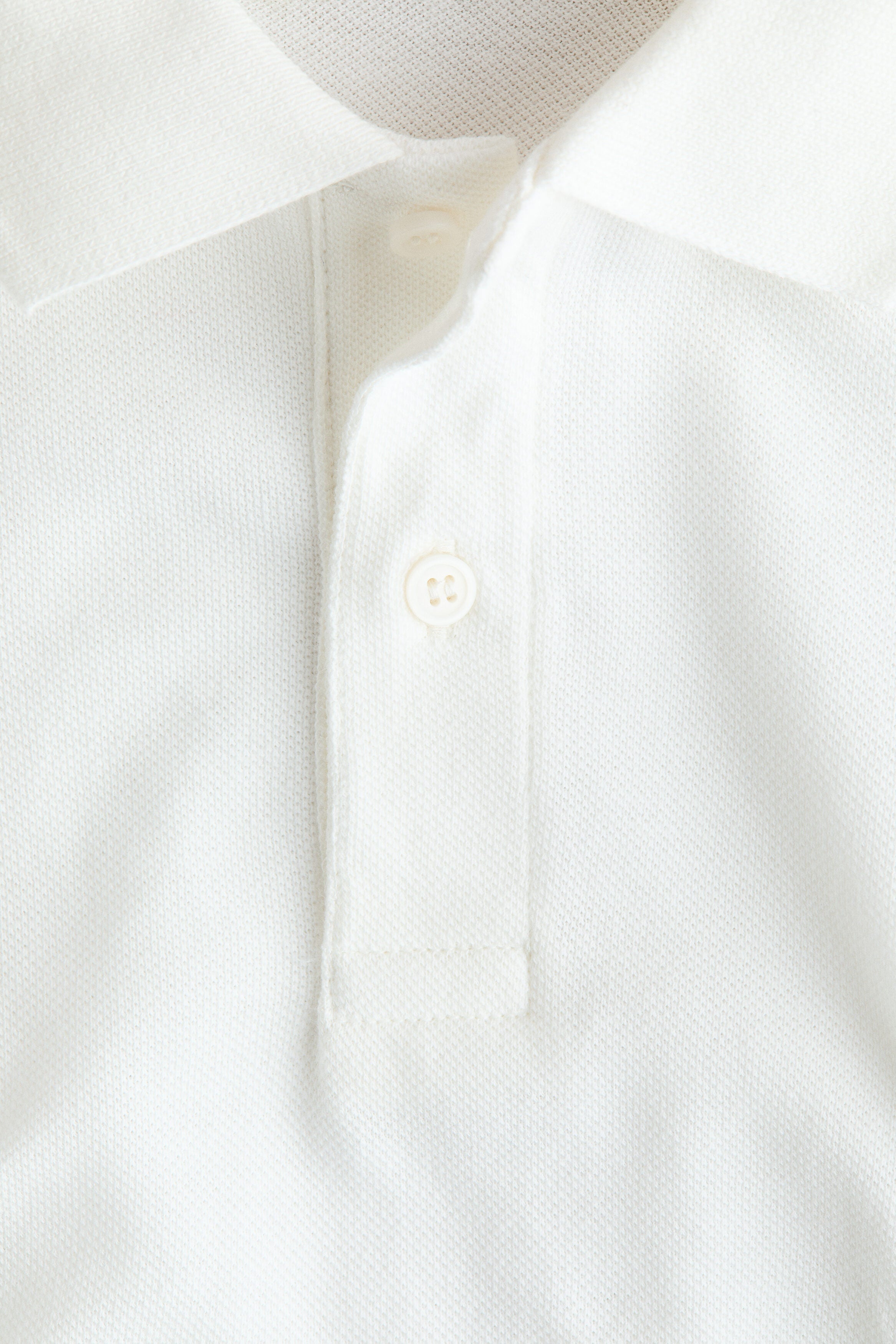 Embroidered-motif piqué polo shirt