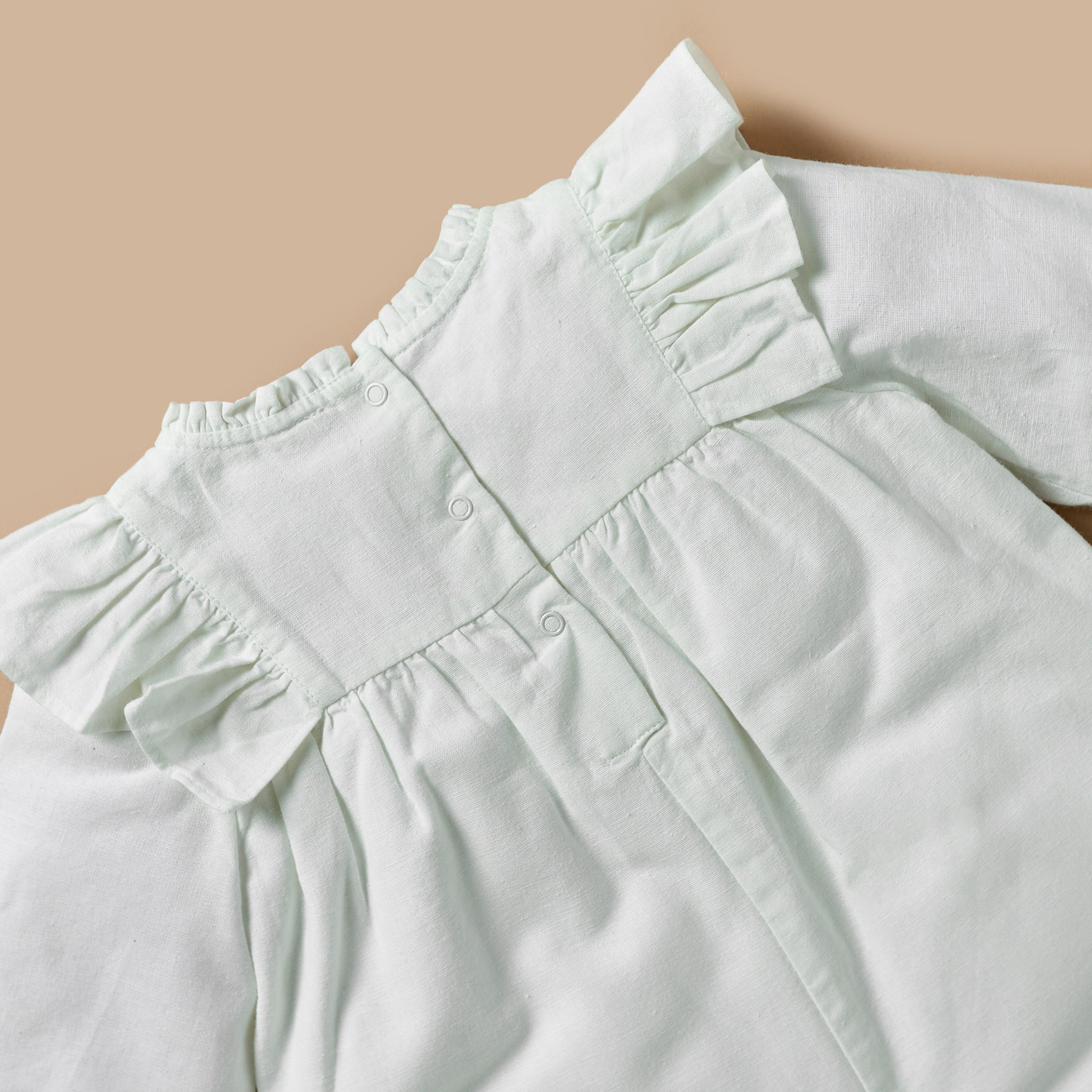 Giggles Textured Romper with Long Sleeves and Ruffle Detail