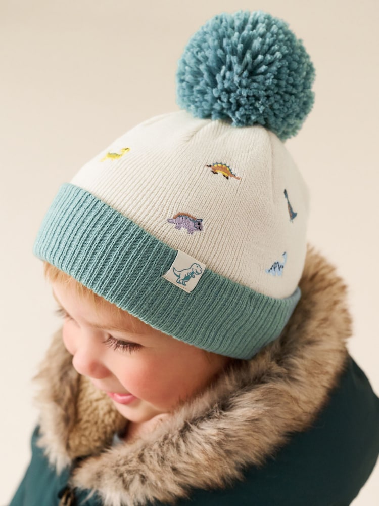 Ecru/Blue Dinosaur Embroidered Pom Beanie (3mths-10yrs) - Ecru/Blue Dinosaur / 12-18 Months (80-86cm)