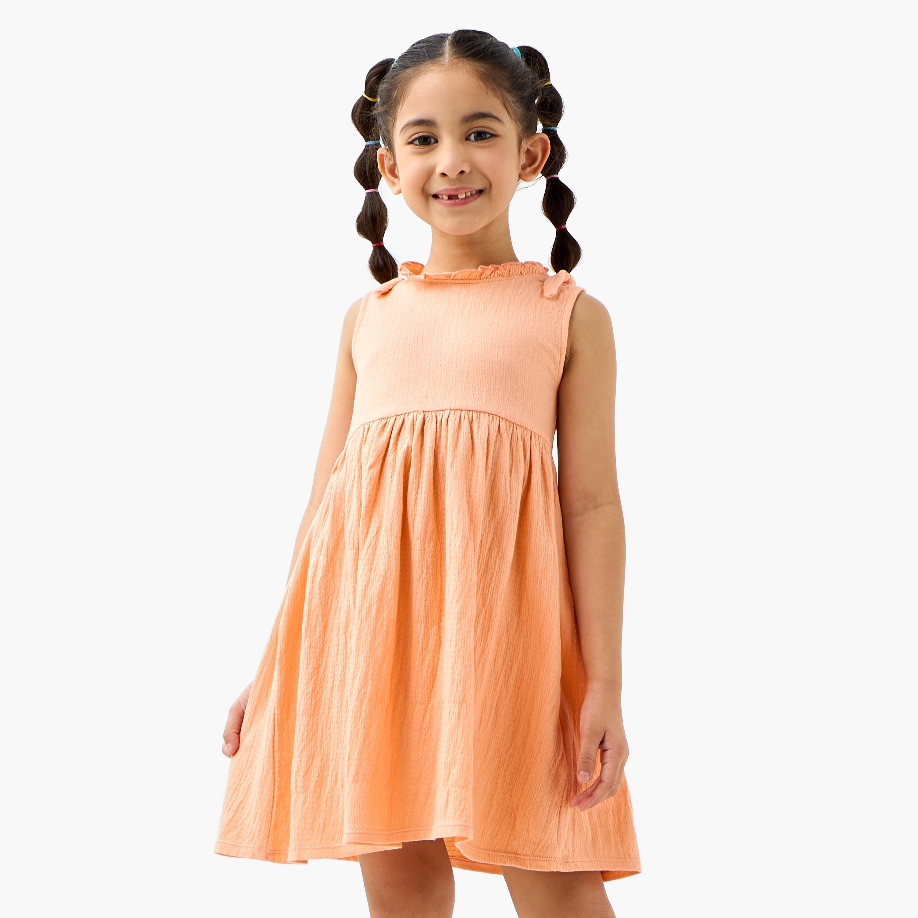 Juniors Textured Sleeveless Dress with Ruffle Trim and Bow Detail