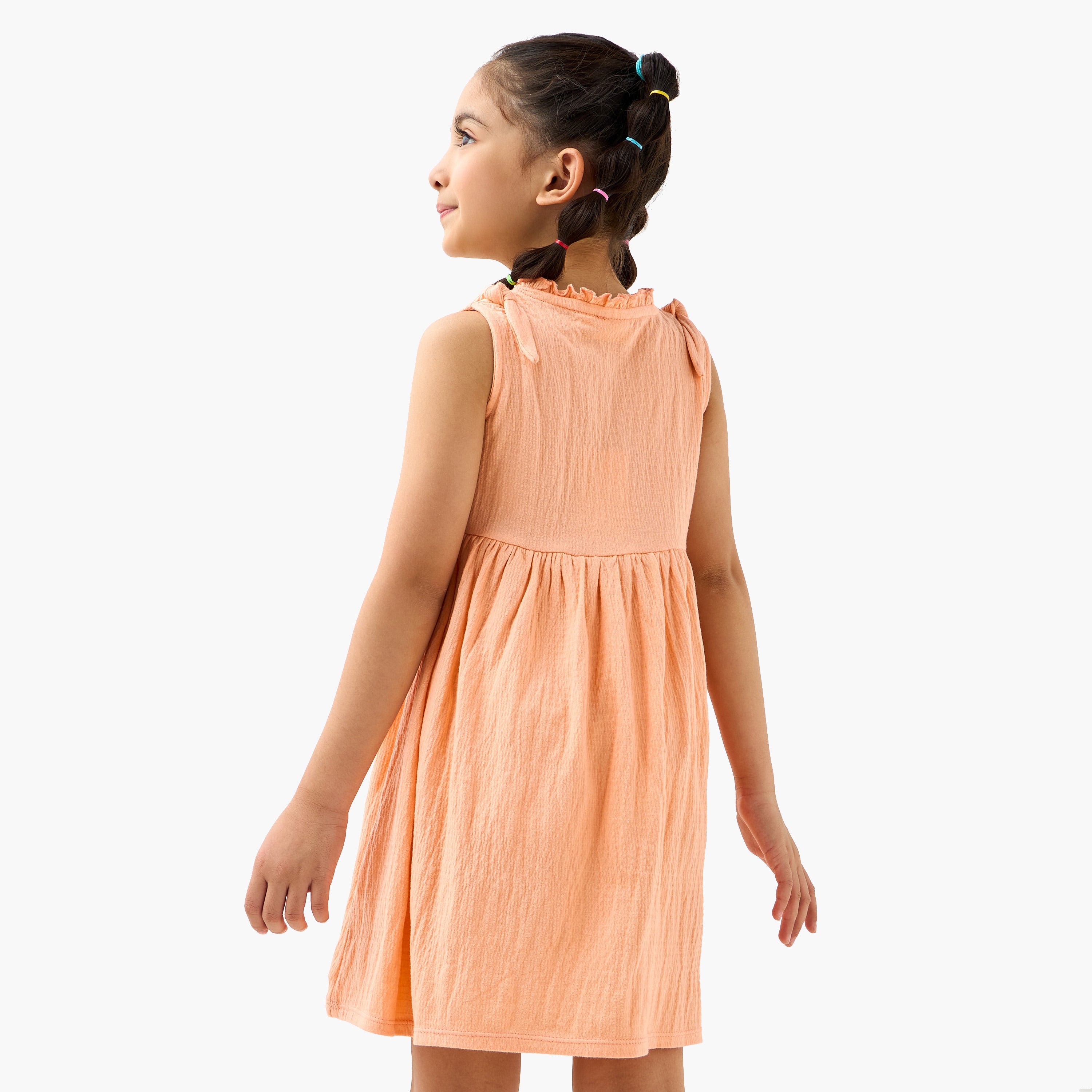 Juniors Textured Sleeveless Dress with Ruffle Trim and Bow Detail