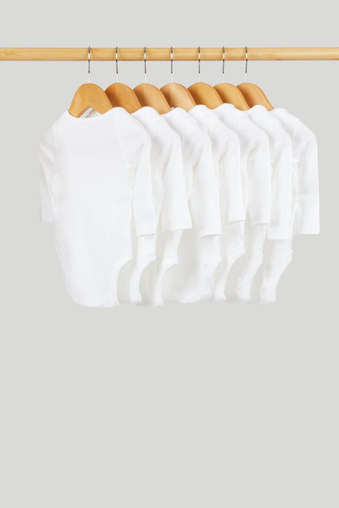 7 Pack White Long-Sleeved Bodysuits