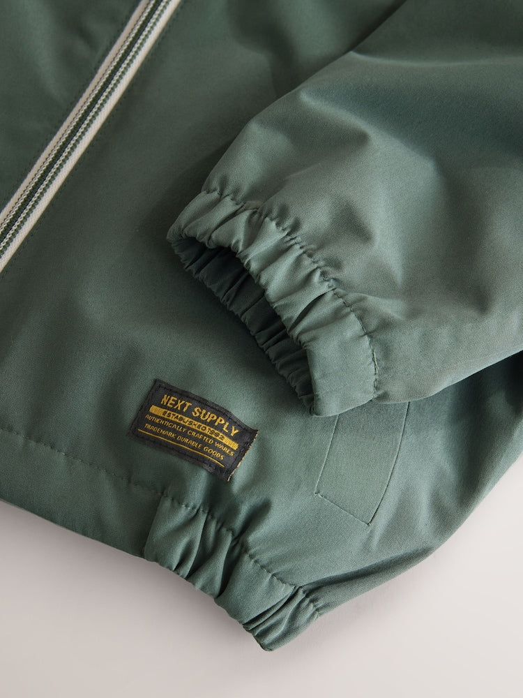 Sage Green Waterproof Cagoule Jacket (3mths-7yrs)