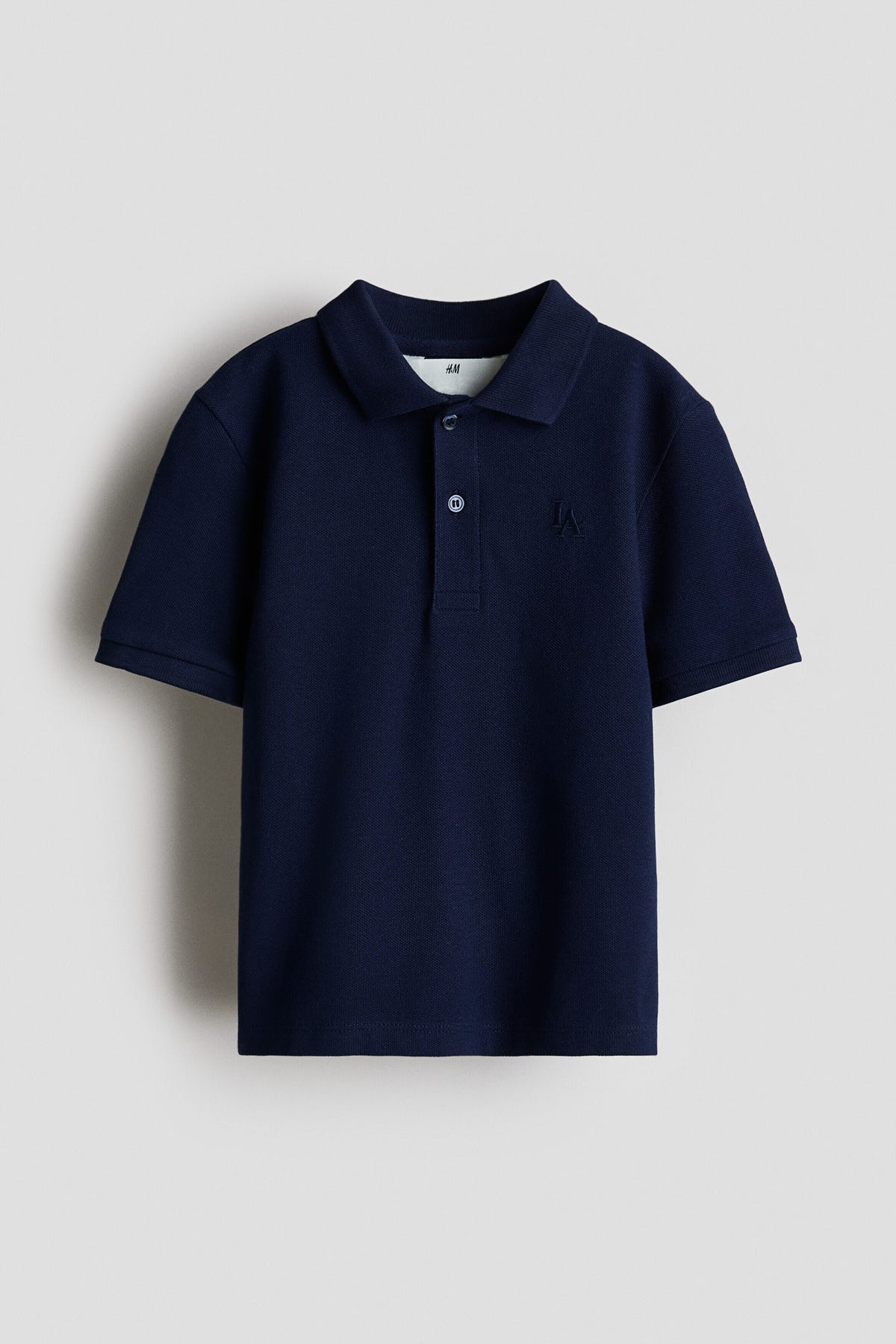 Embroidered-motif piqué polo shirt