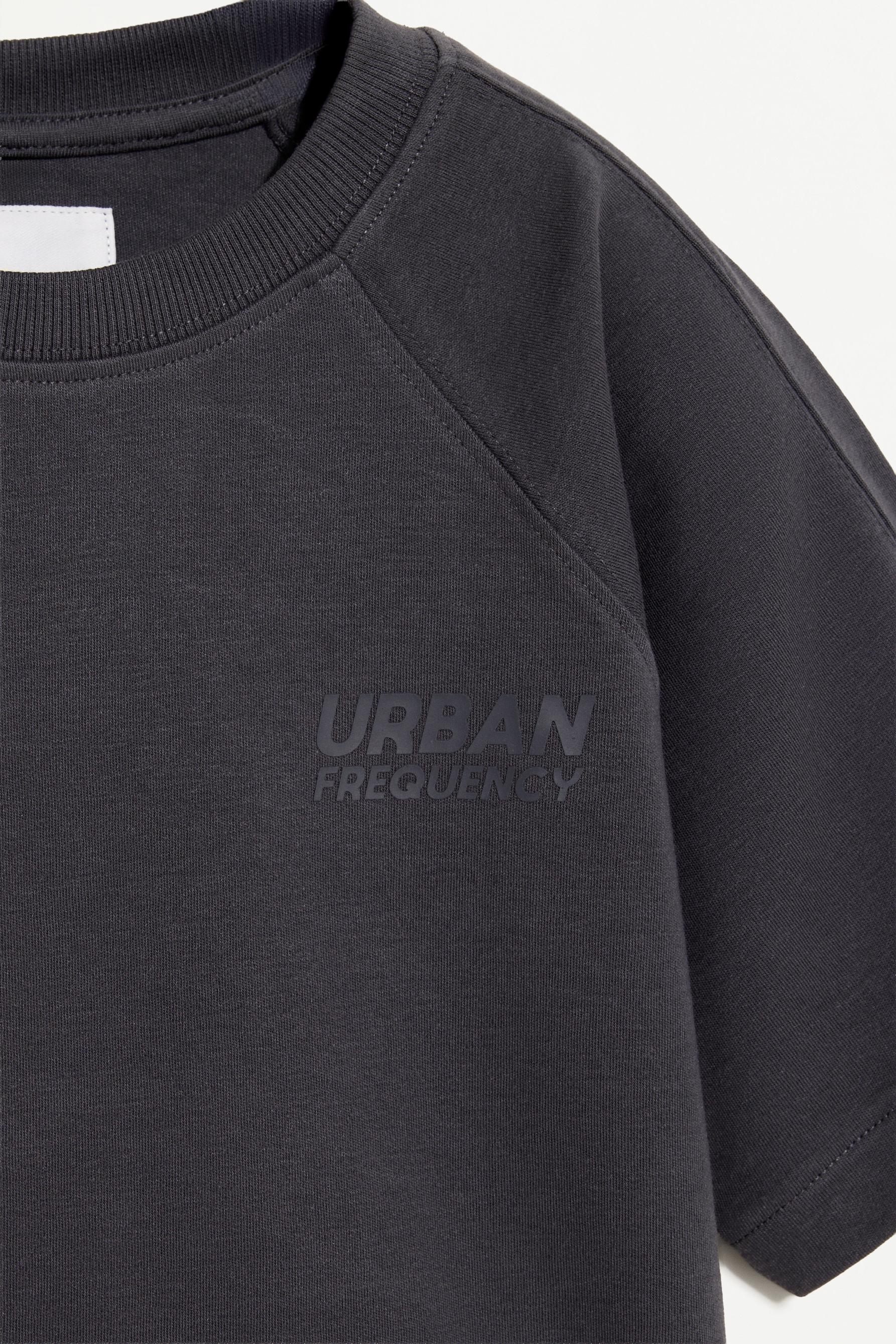 Interlock T-shirt with rubberised slogan