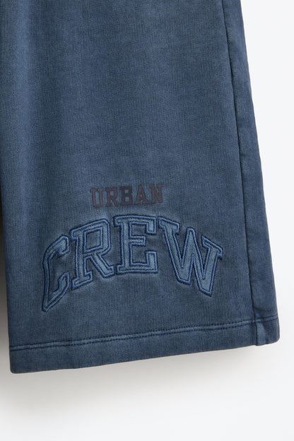 Bermuda shorts with text patches
