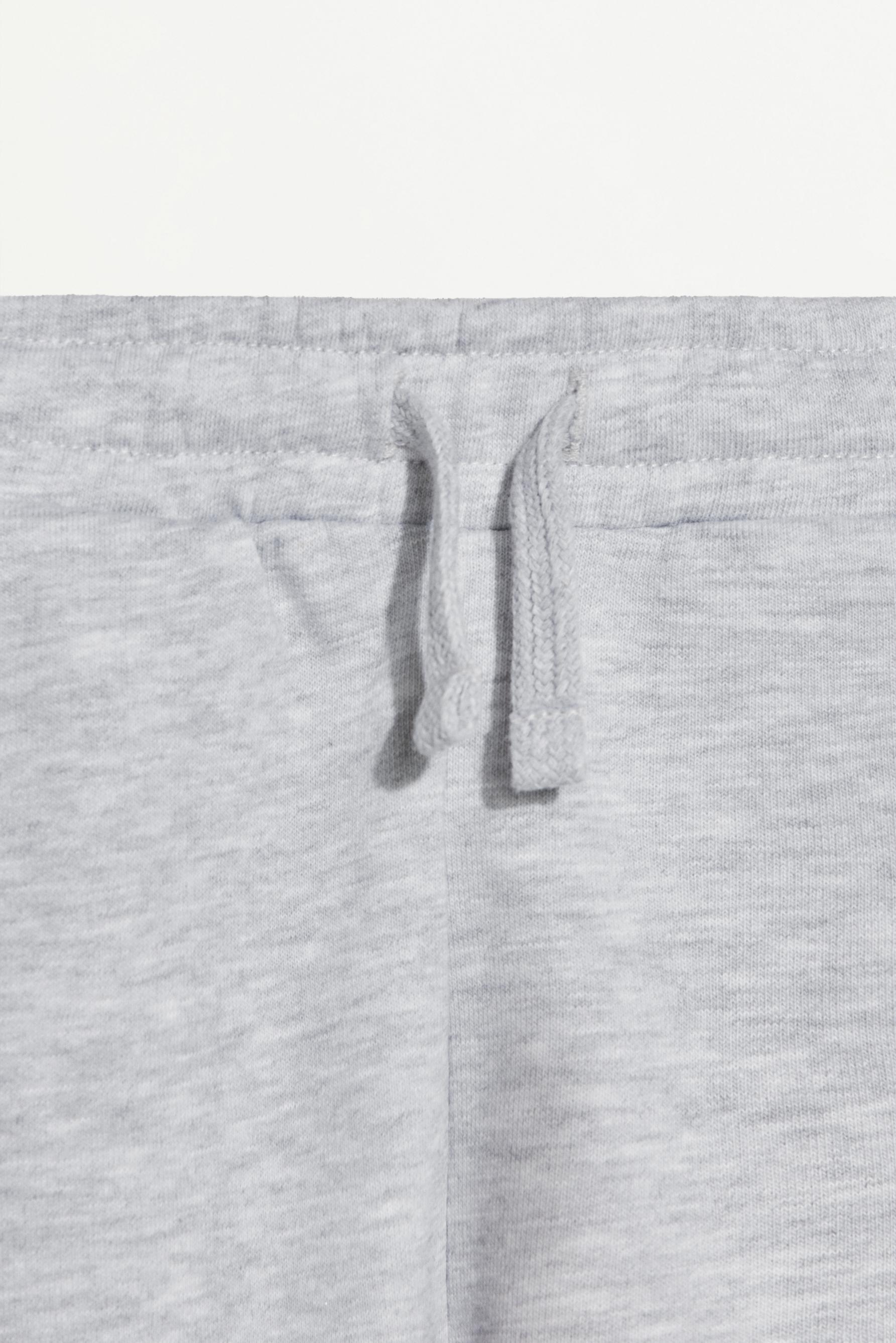 Plush Bermuda shorts with text