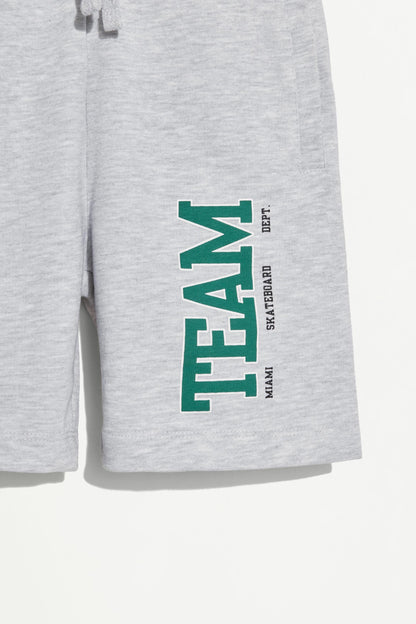 Plush Bermuda shorts with text