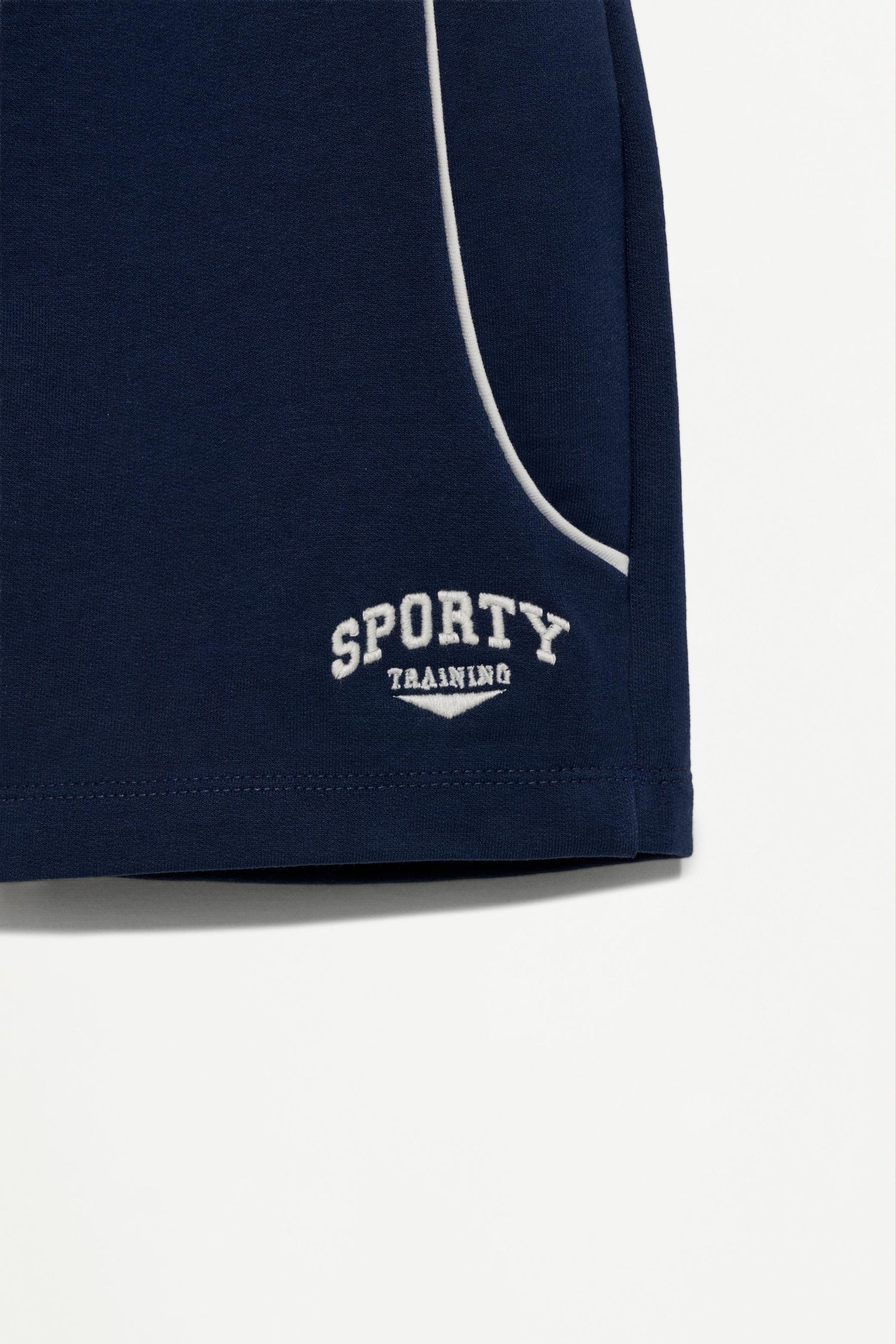 Plush Bermuda shorts with contrast stitching