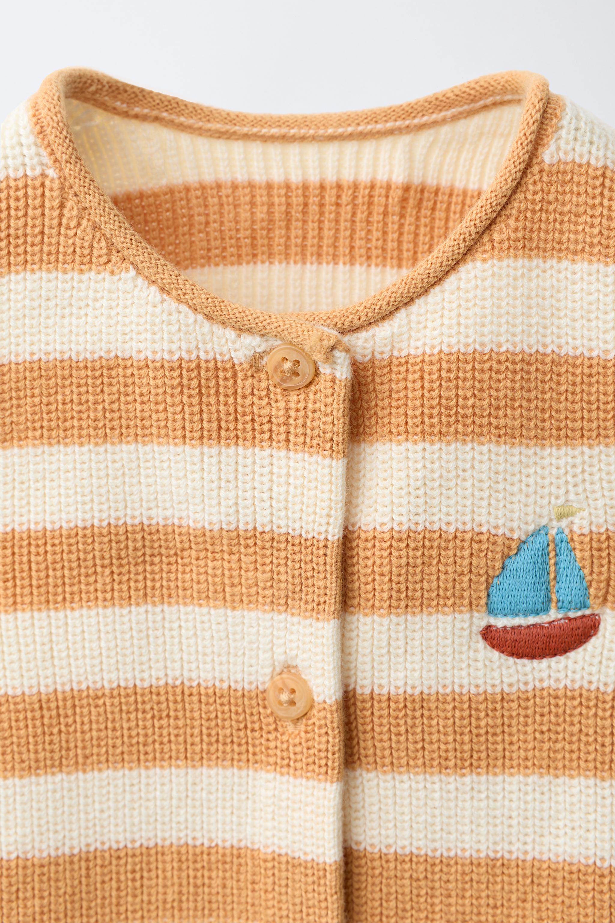 KNITTED STRIPED ROMPER WITH EMBROIDERED BOAT
