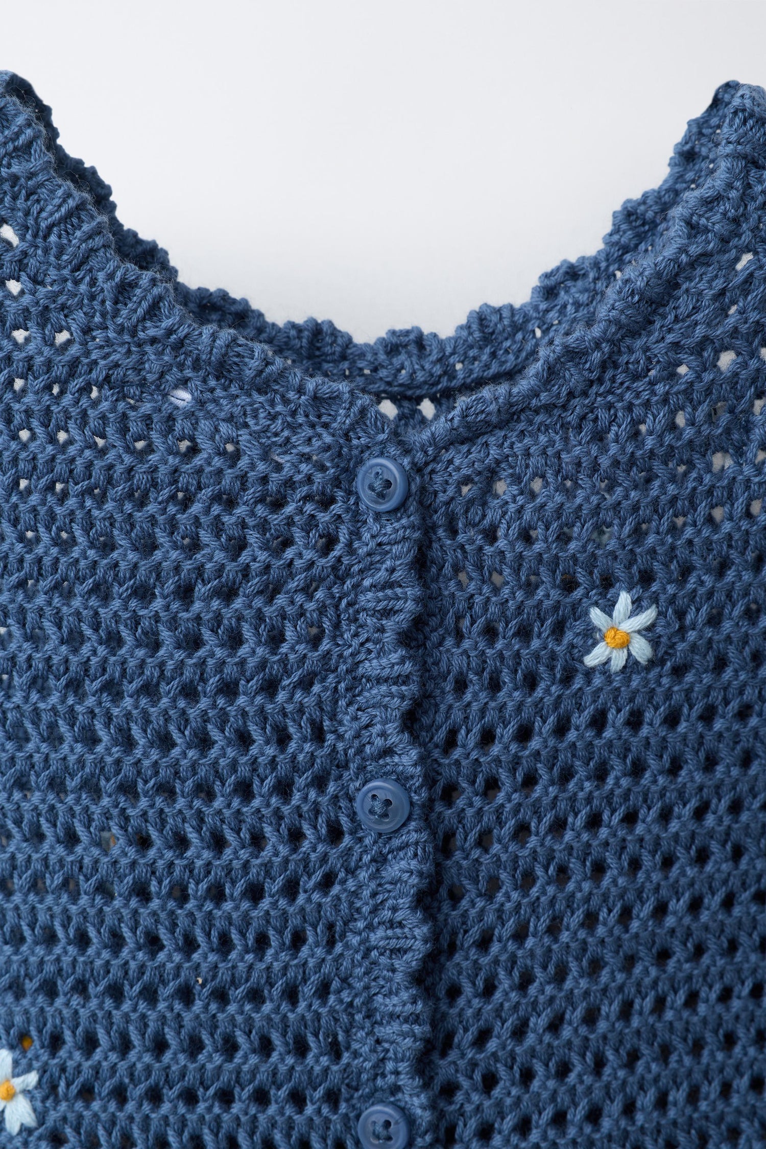 CUTWORK KNIT ROMPER WITH EMBROIDERED FLOWERS