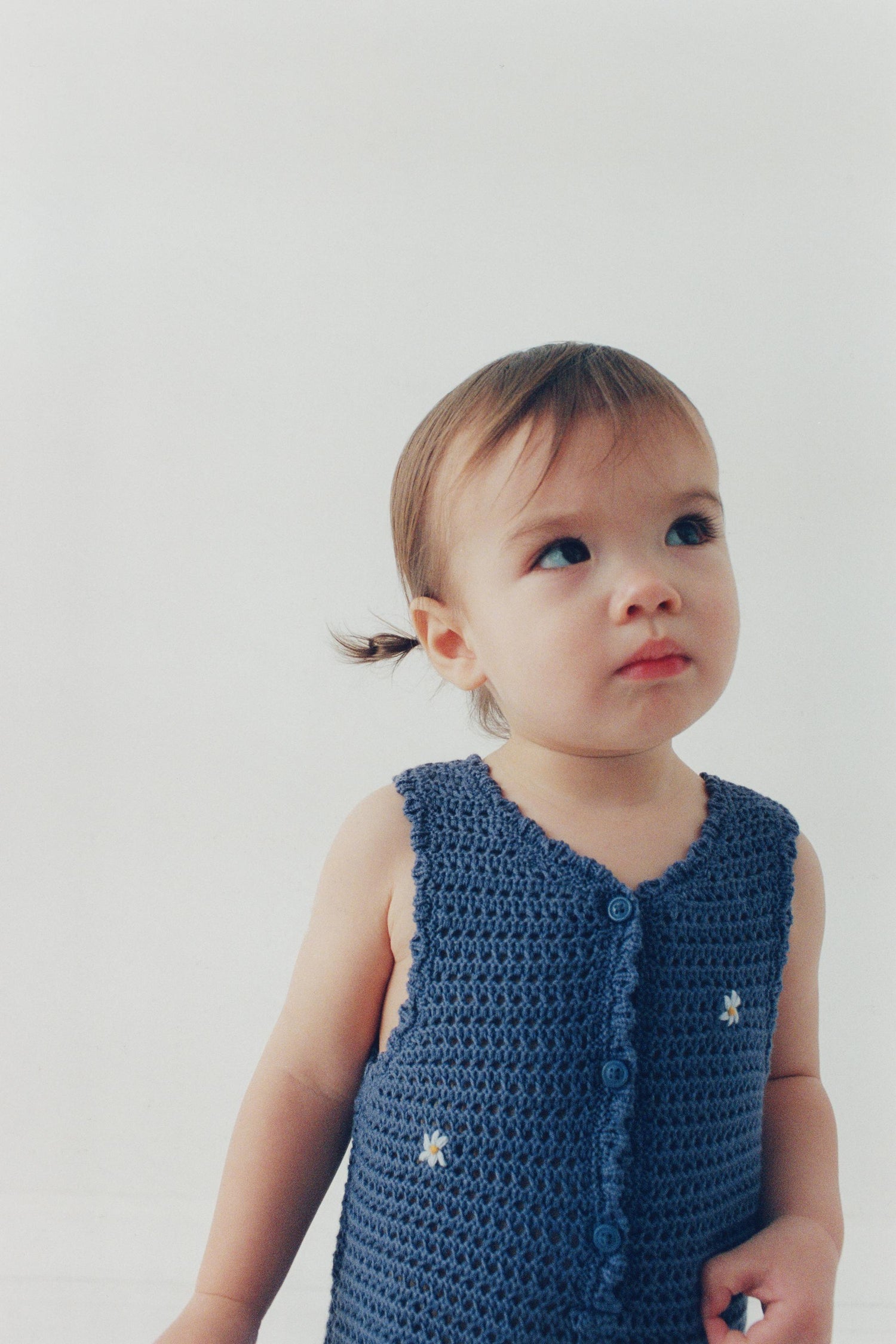 CUTWORK KNIT ROMPER WITH EMBROIDERED FLOWERS