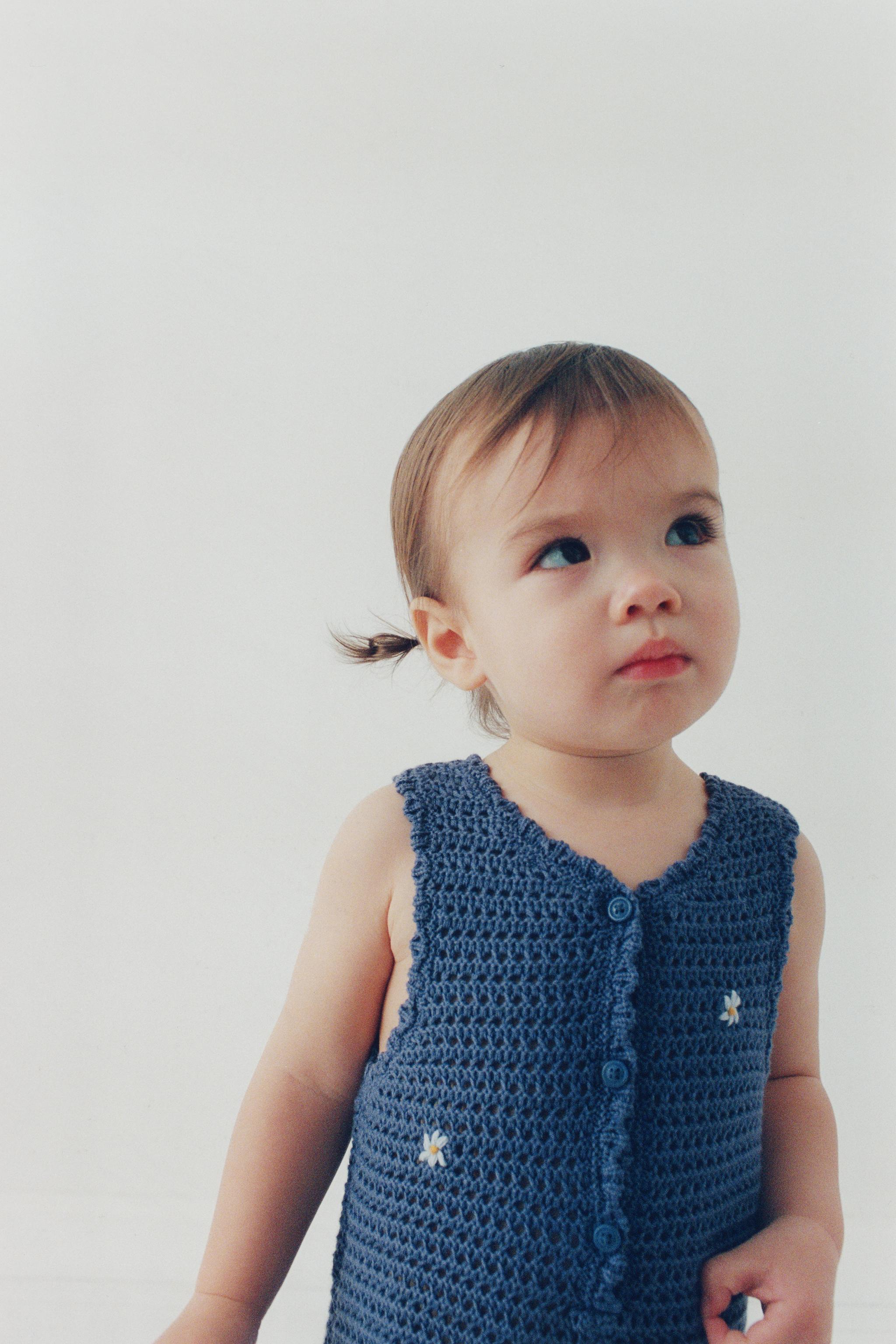 CUTWORK KNIT ROMPER WITH EMBROIDERED FLOWERS