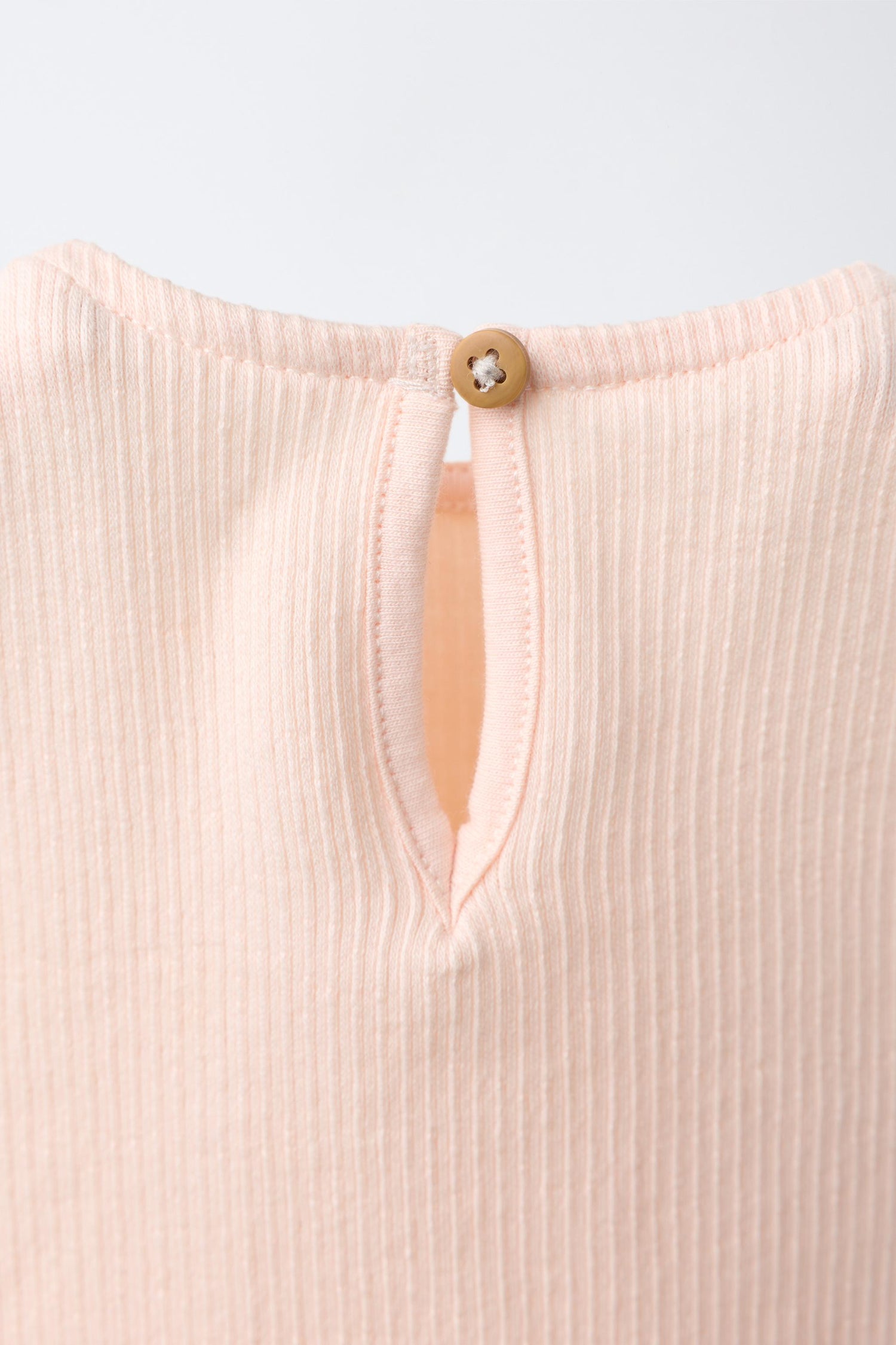 EMBROIDERED SUN RUFFLE BODYSUIT