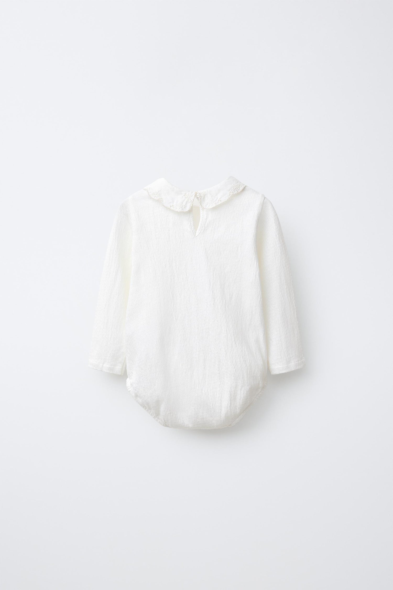 BODYSUIT WITH PETER PAN COLLAR AND SWISS EMBROIDERY
