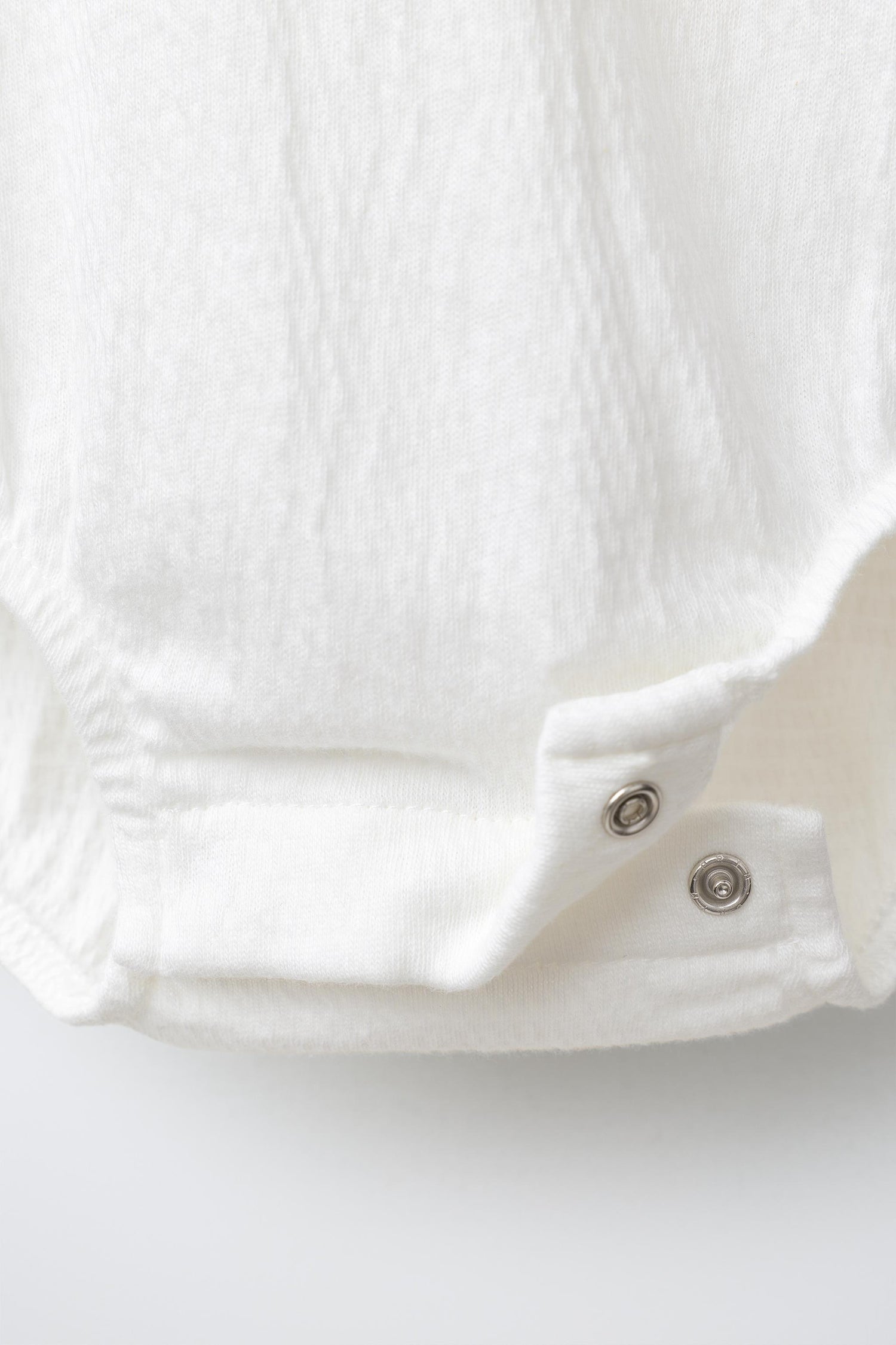BODYSUIT WITH PETER PAN COLLAR AND SWISS EMBROIDERY