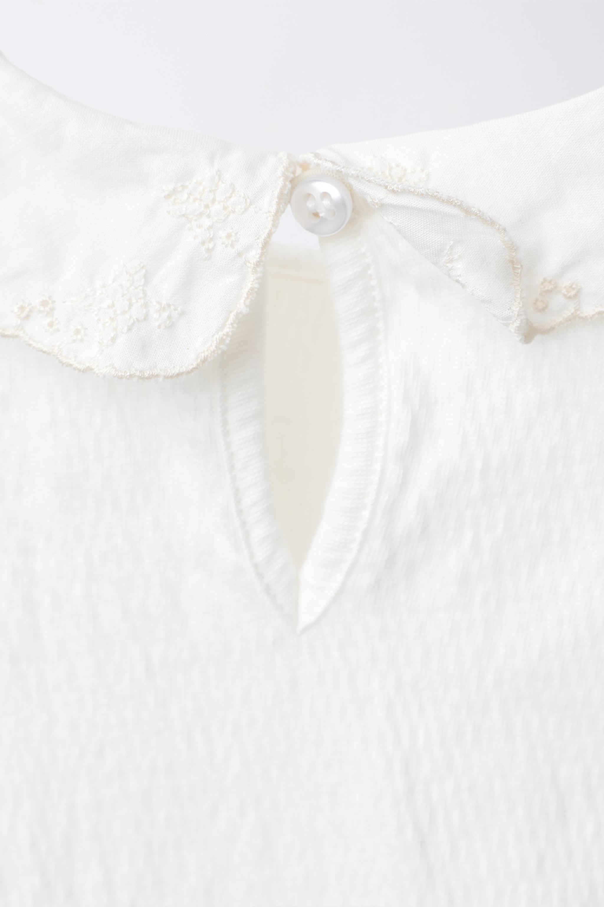 BODYSUIT WITH PETER PAN COLLAR AND SWISS EMBROIDERY