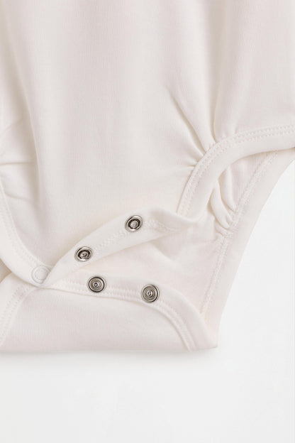 Plain long sleeve bodysuits (4-pack)