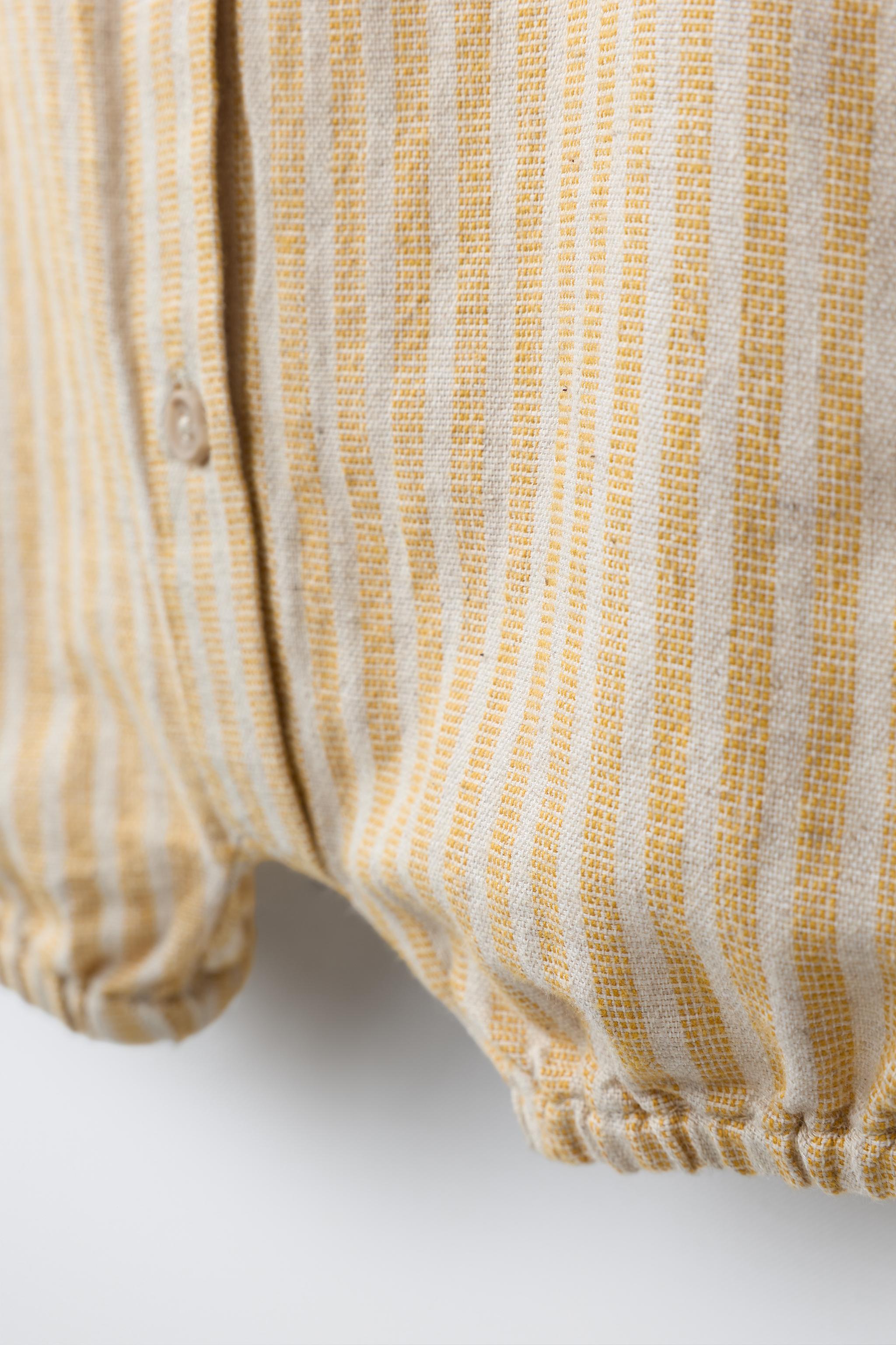 STRIPED COTTON AND LINEN ROMPER
