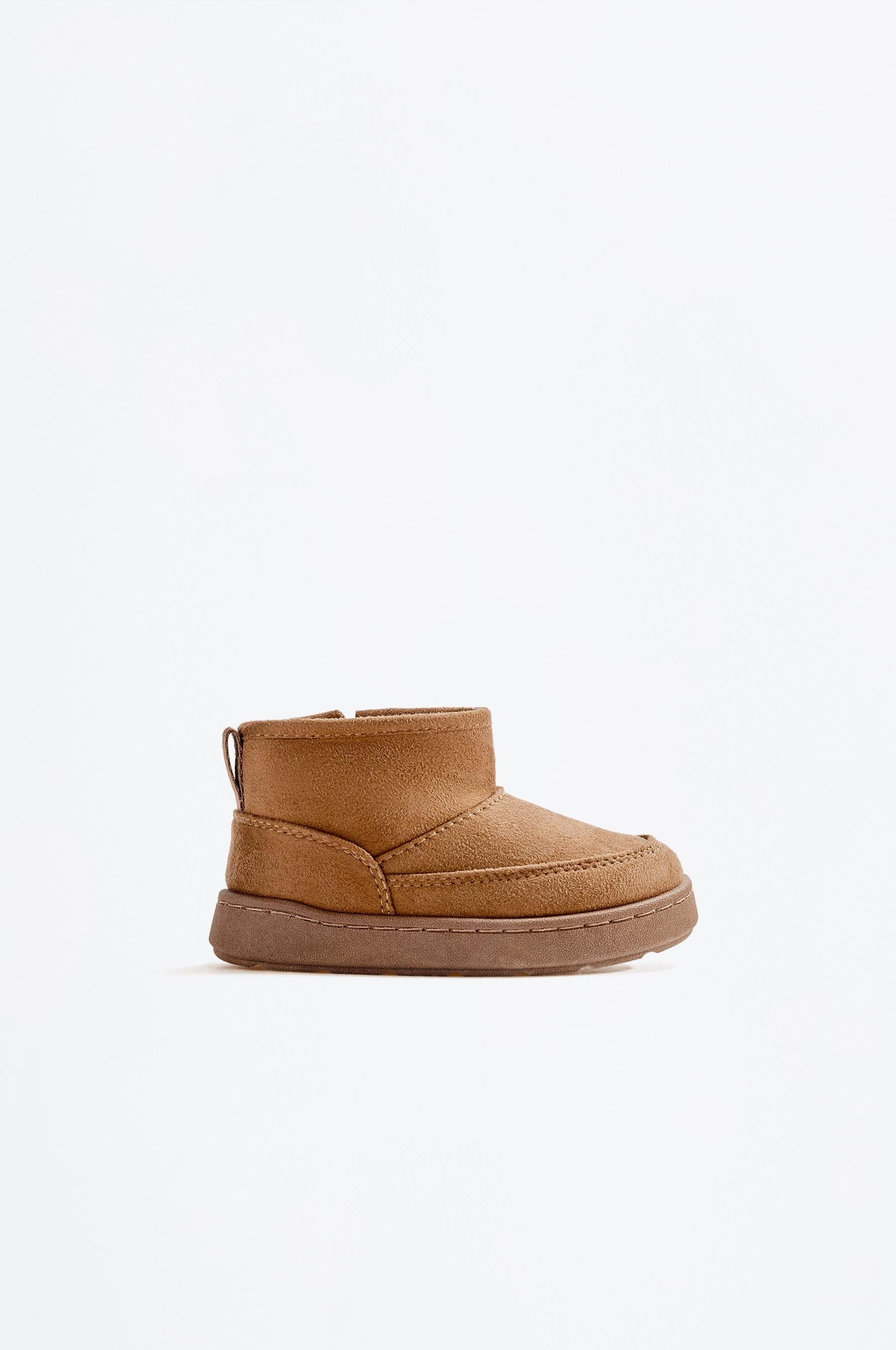 Lined faux fur boot