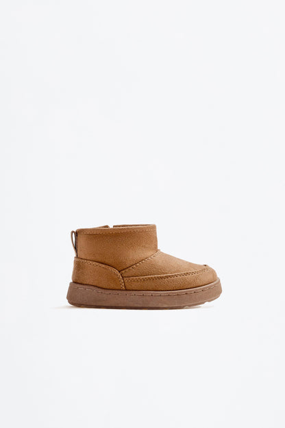 Lined faux fur boot