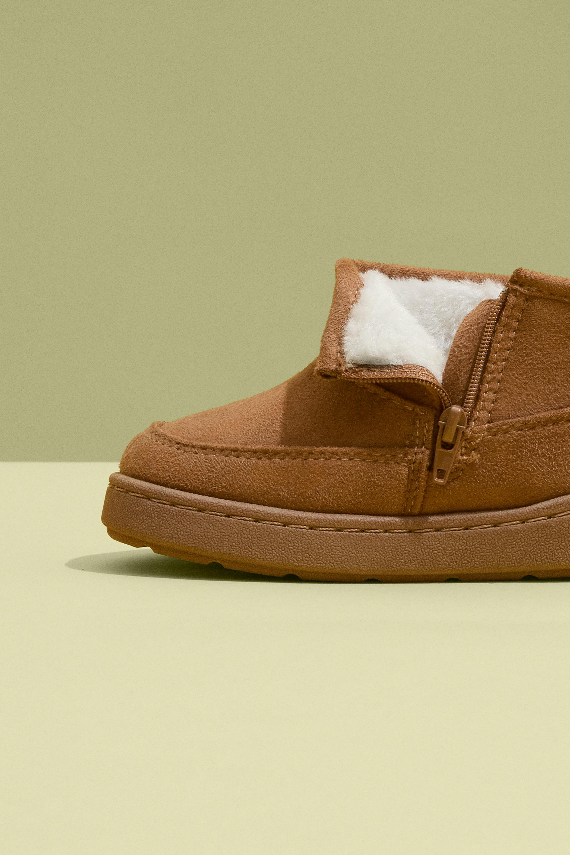 Lined faux fur boot