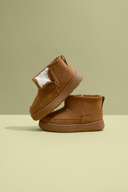Lined faux fur boot