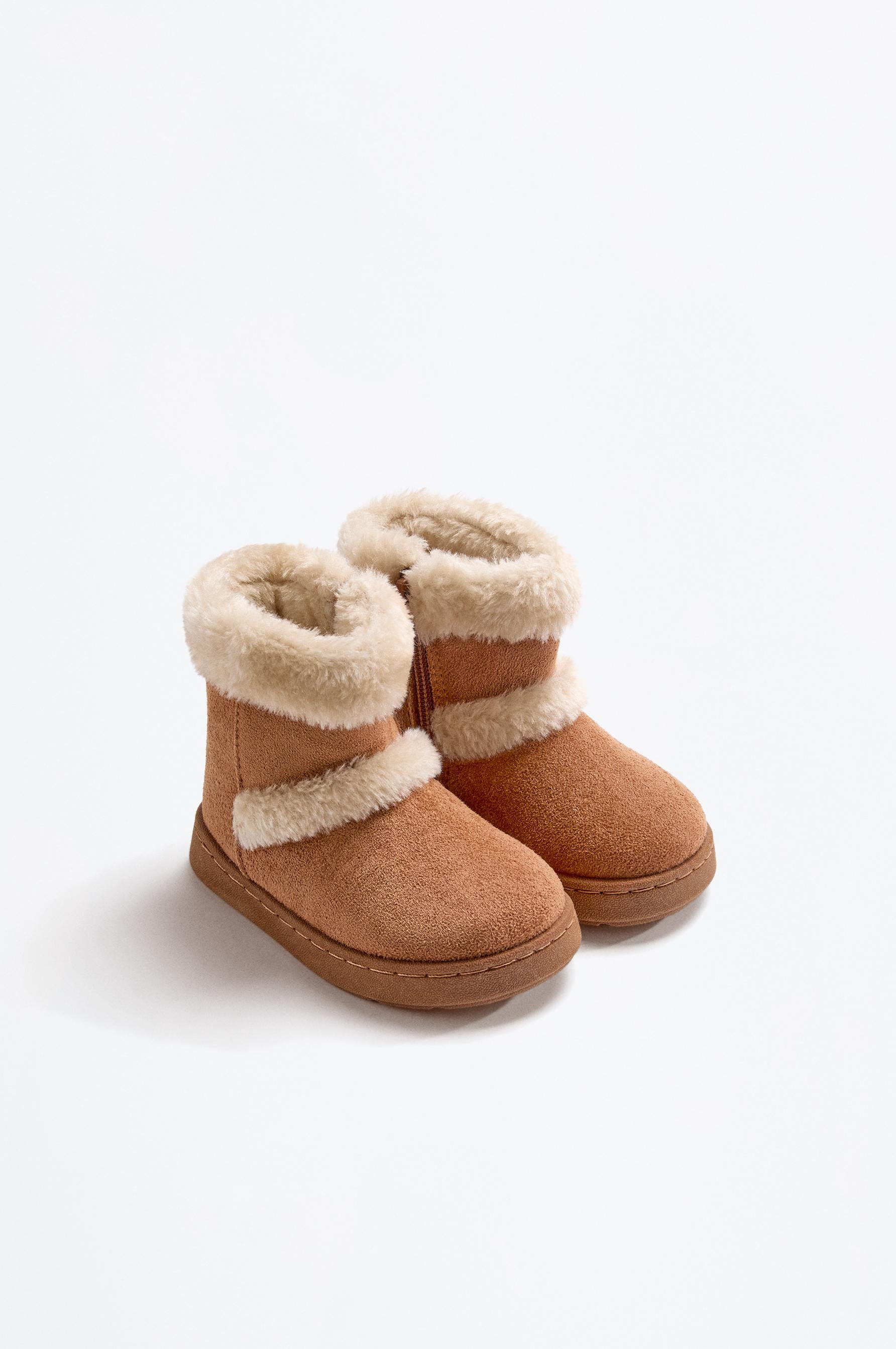Knee-high fur boots