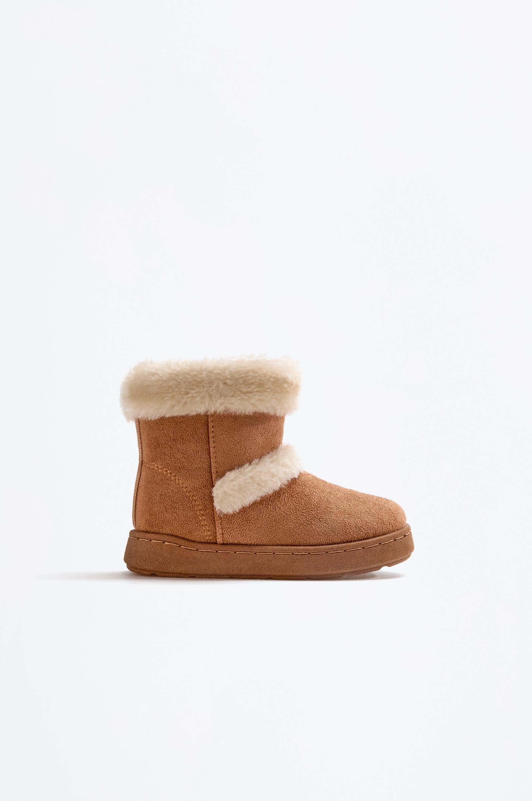 Knee-high fur boots
