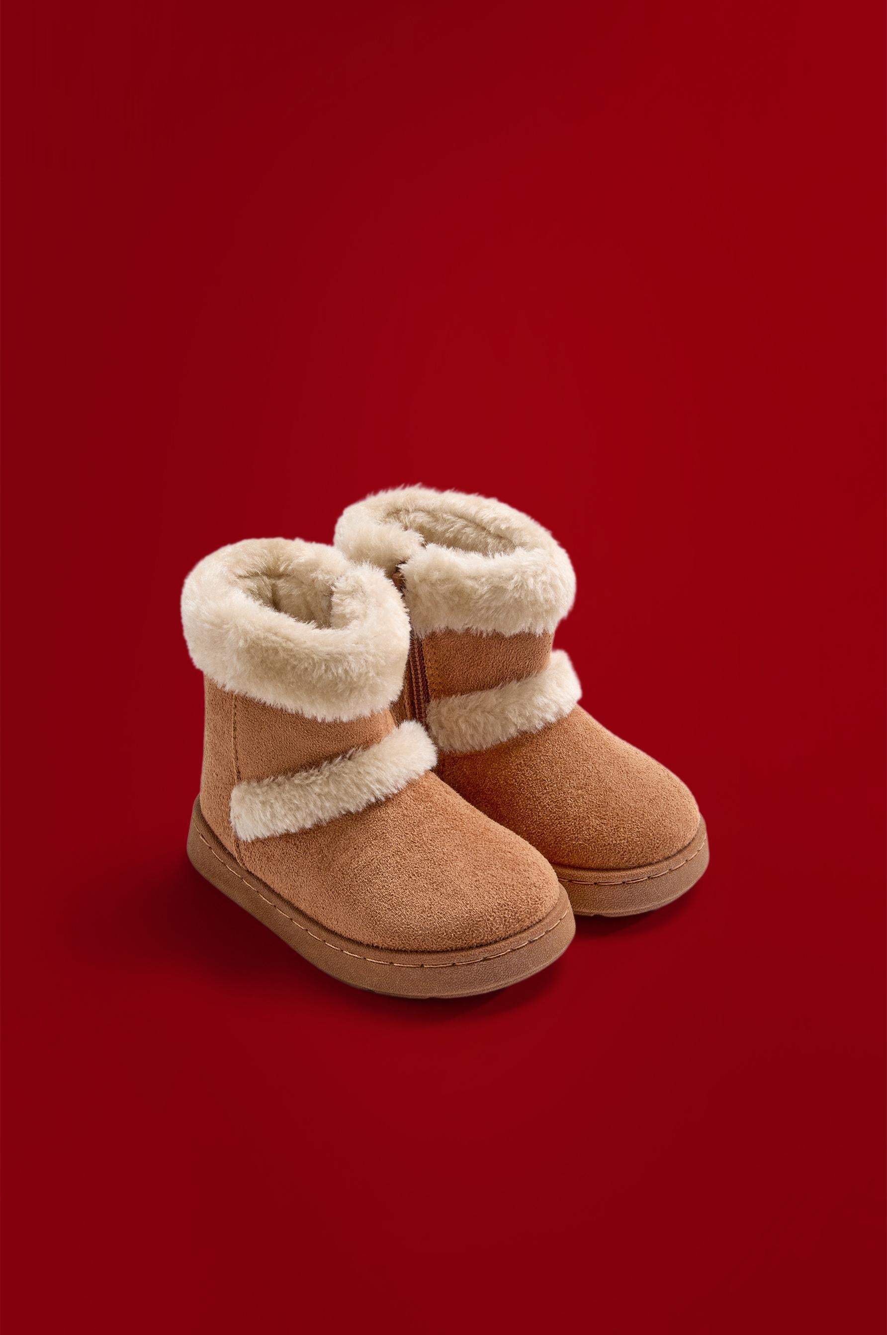 Knee-high fur boots