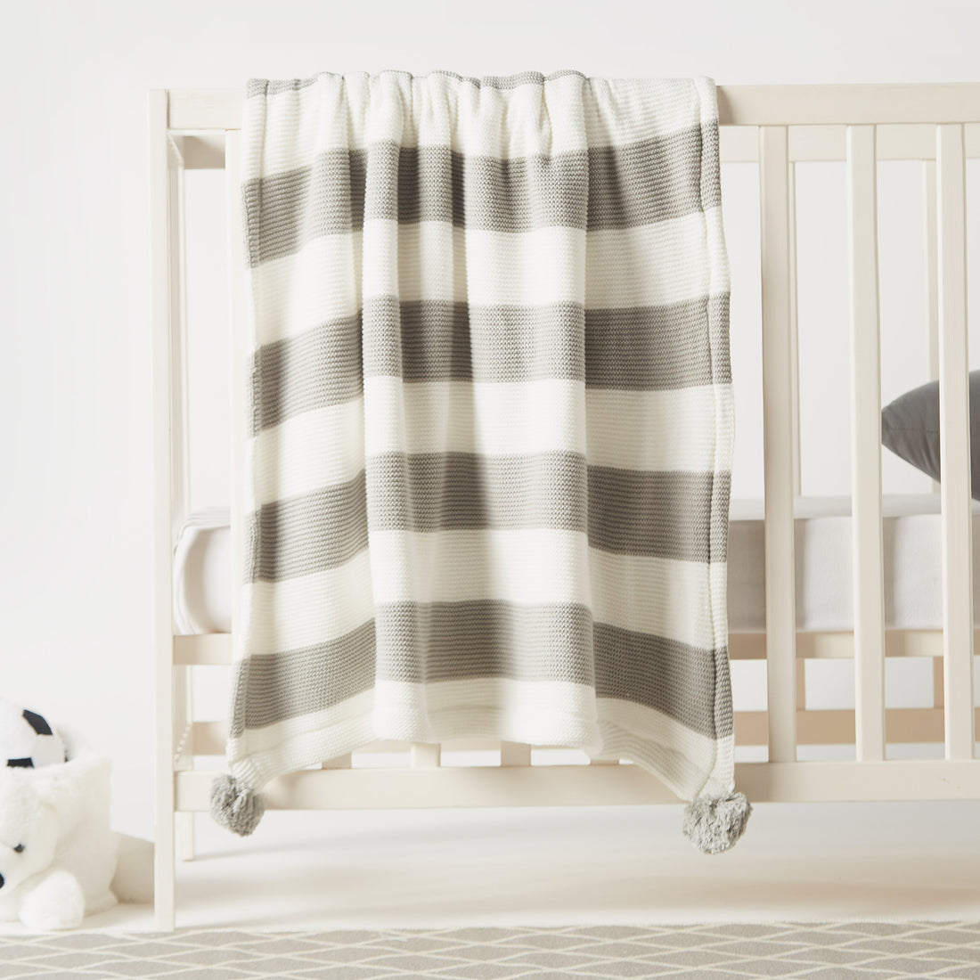 Juniors Striped Knitted Raschel Blanket with Pom Pom Detail - 100x80 cms - HomeBabyNurseryBlankets &amp; SwaddlesBlankets &amp; Quilts