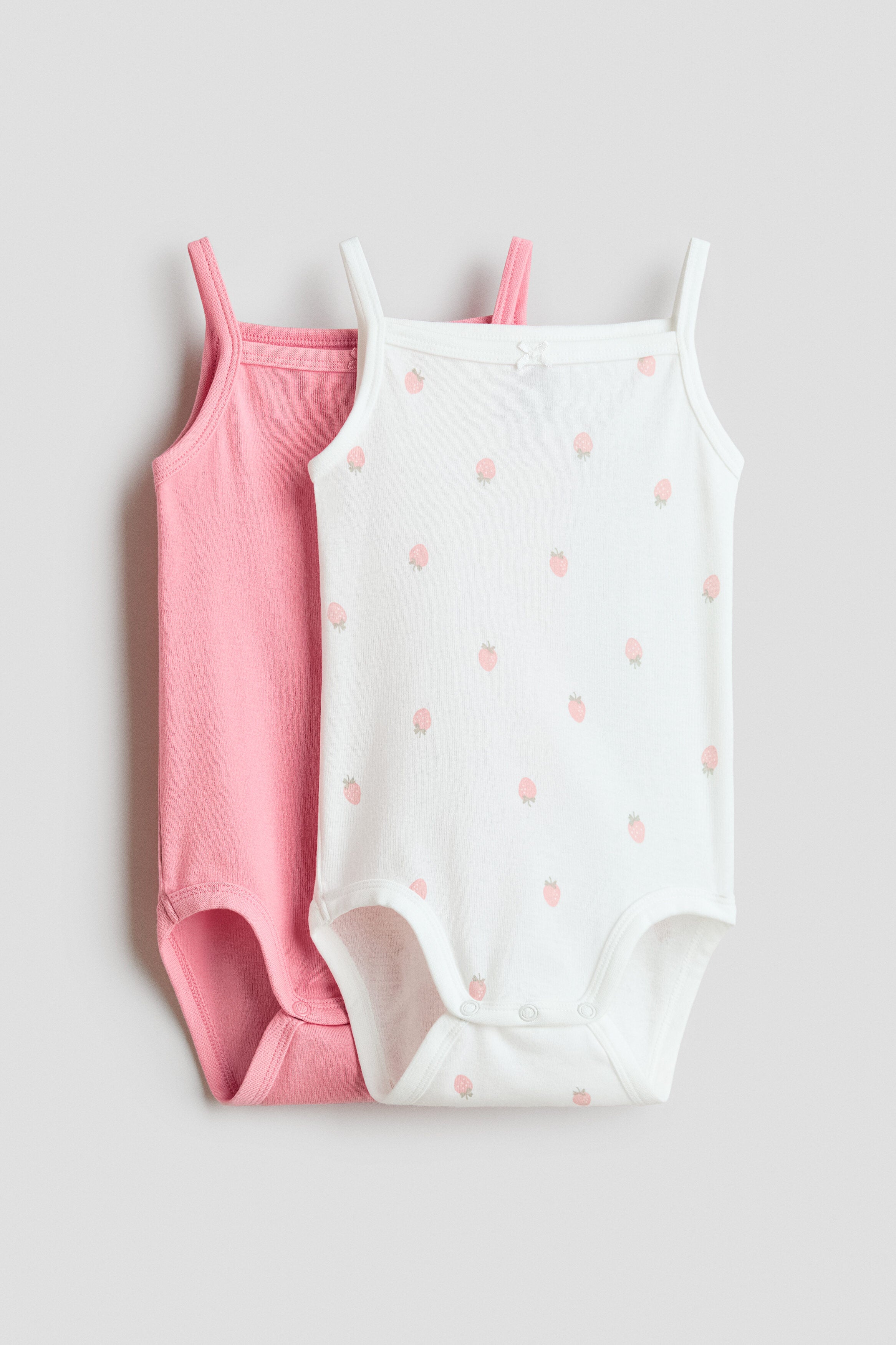 2-pack sleeveless cotton bodysuits - 18M