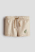 Embroidery-motif swimming trunks - Beige T Rex / 1.5-2 Years