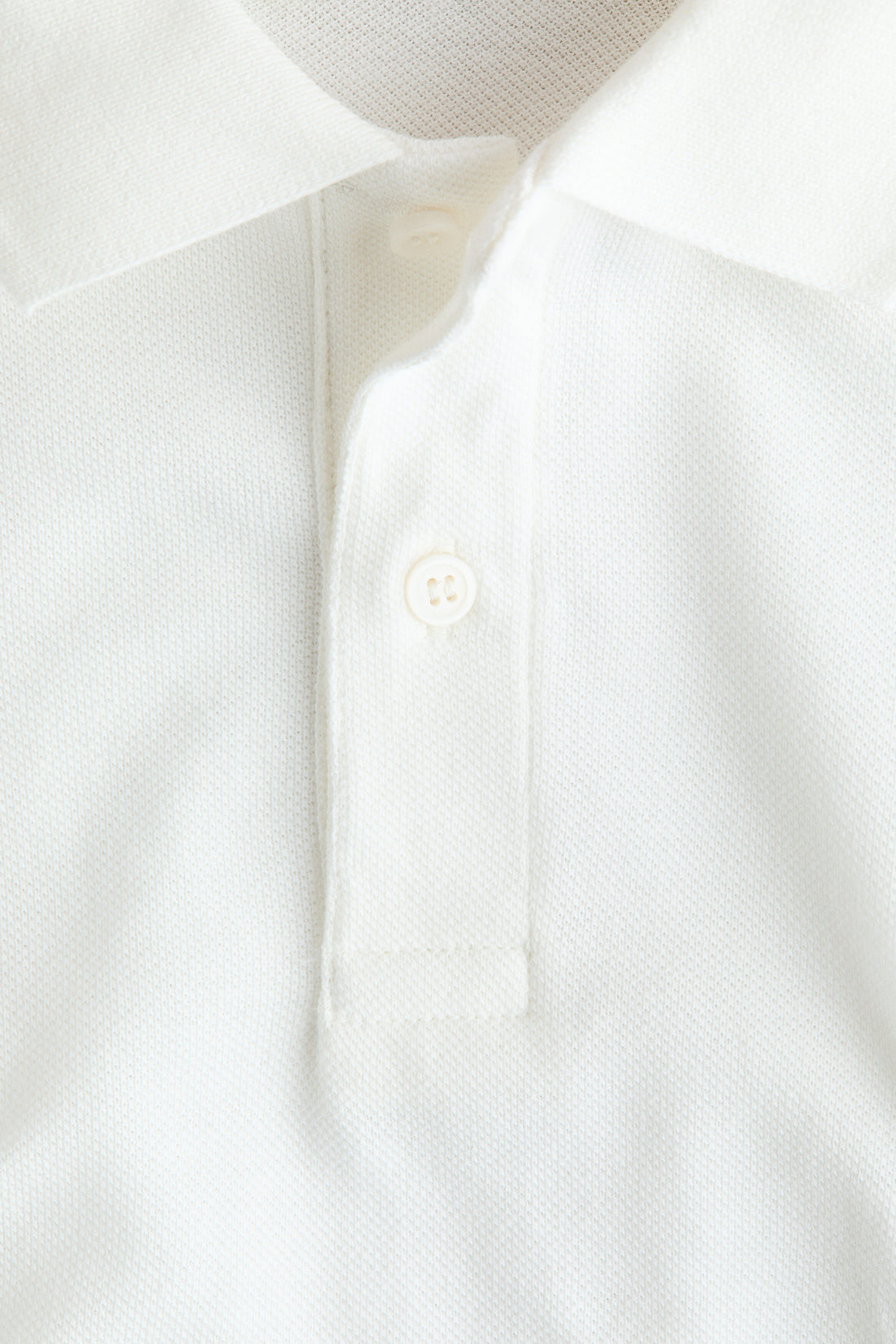 Embroidered-motif piqué polo shirt