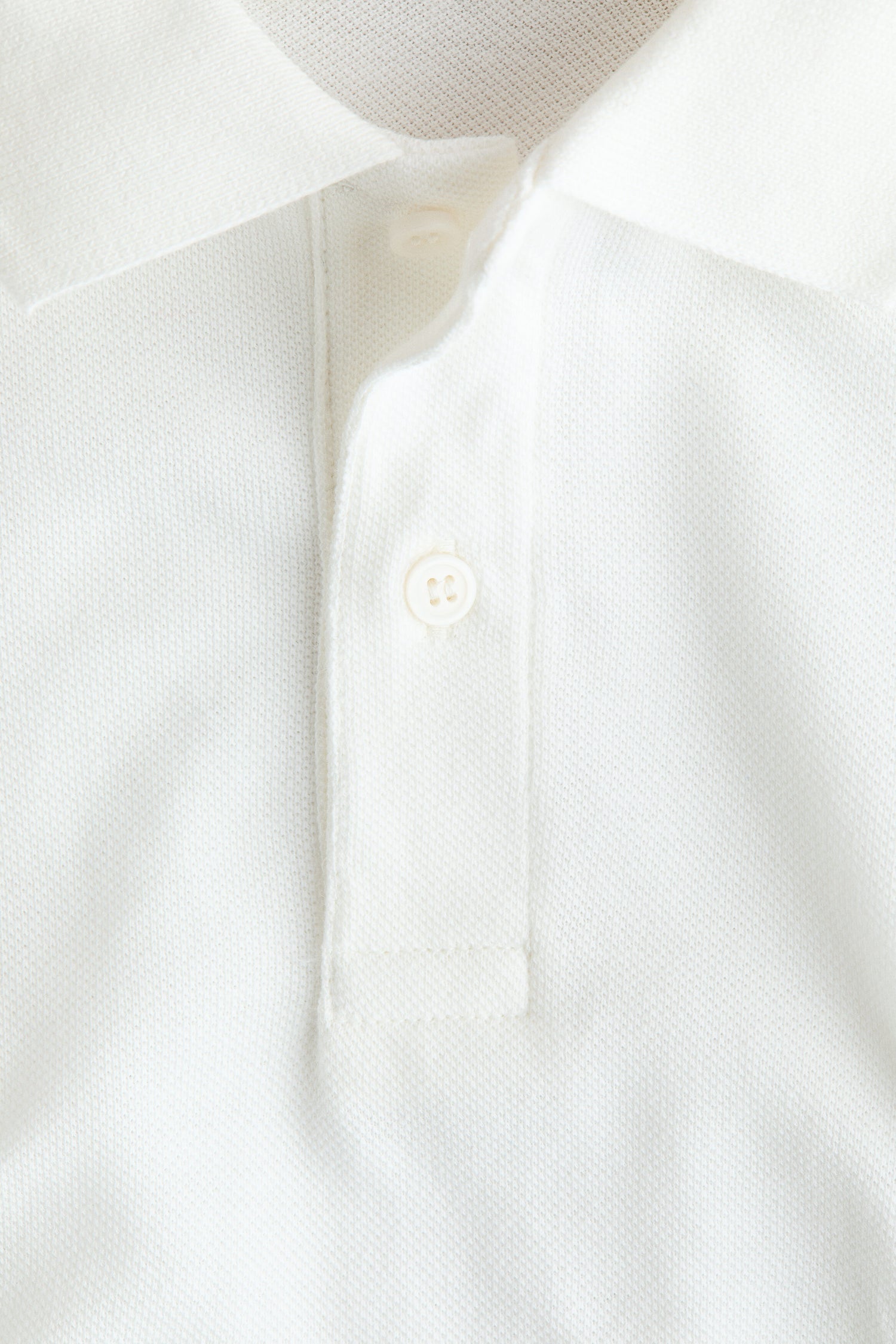 Embroidered-motif piqué polo shirt