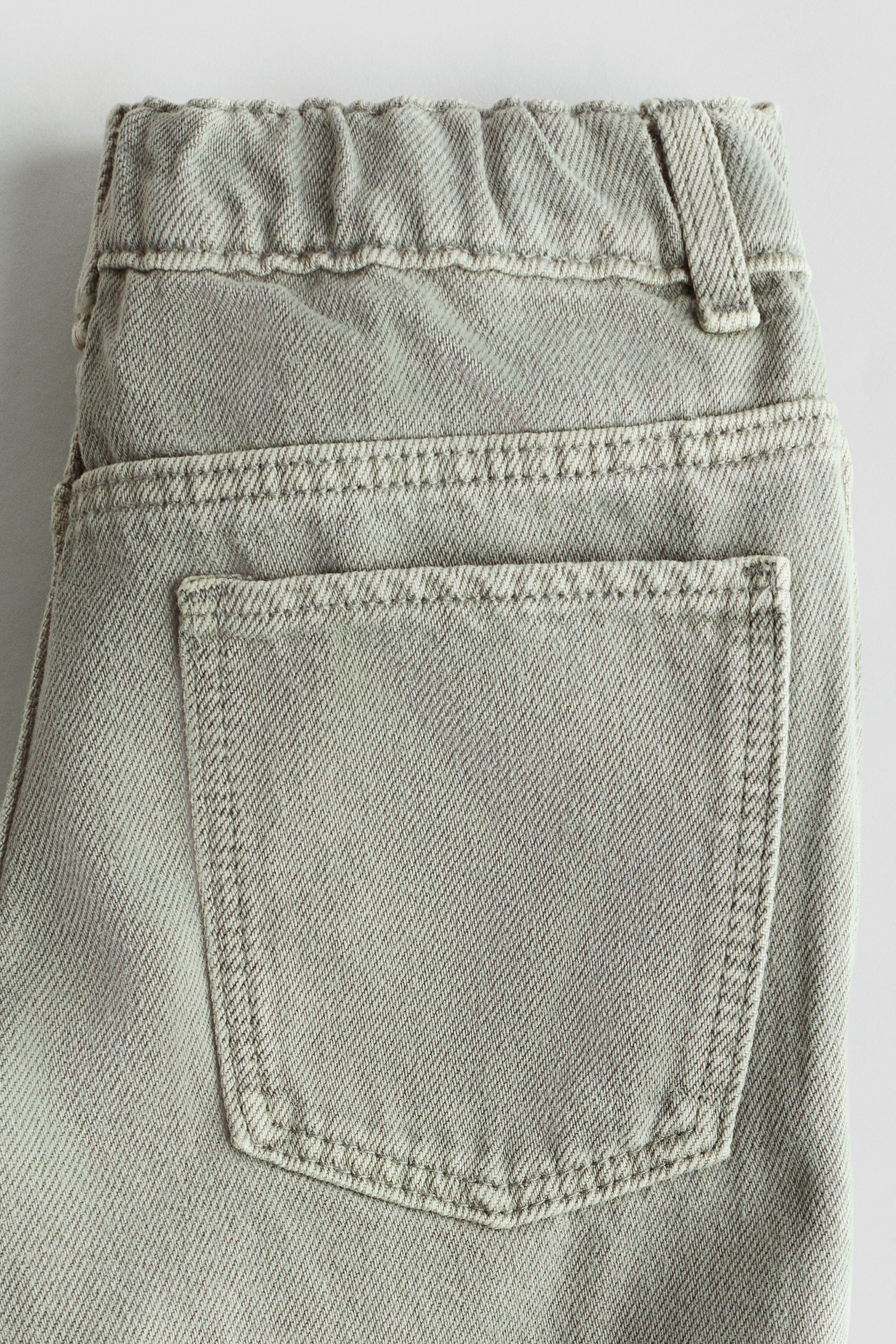 Tapered cotton-blend jeans