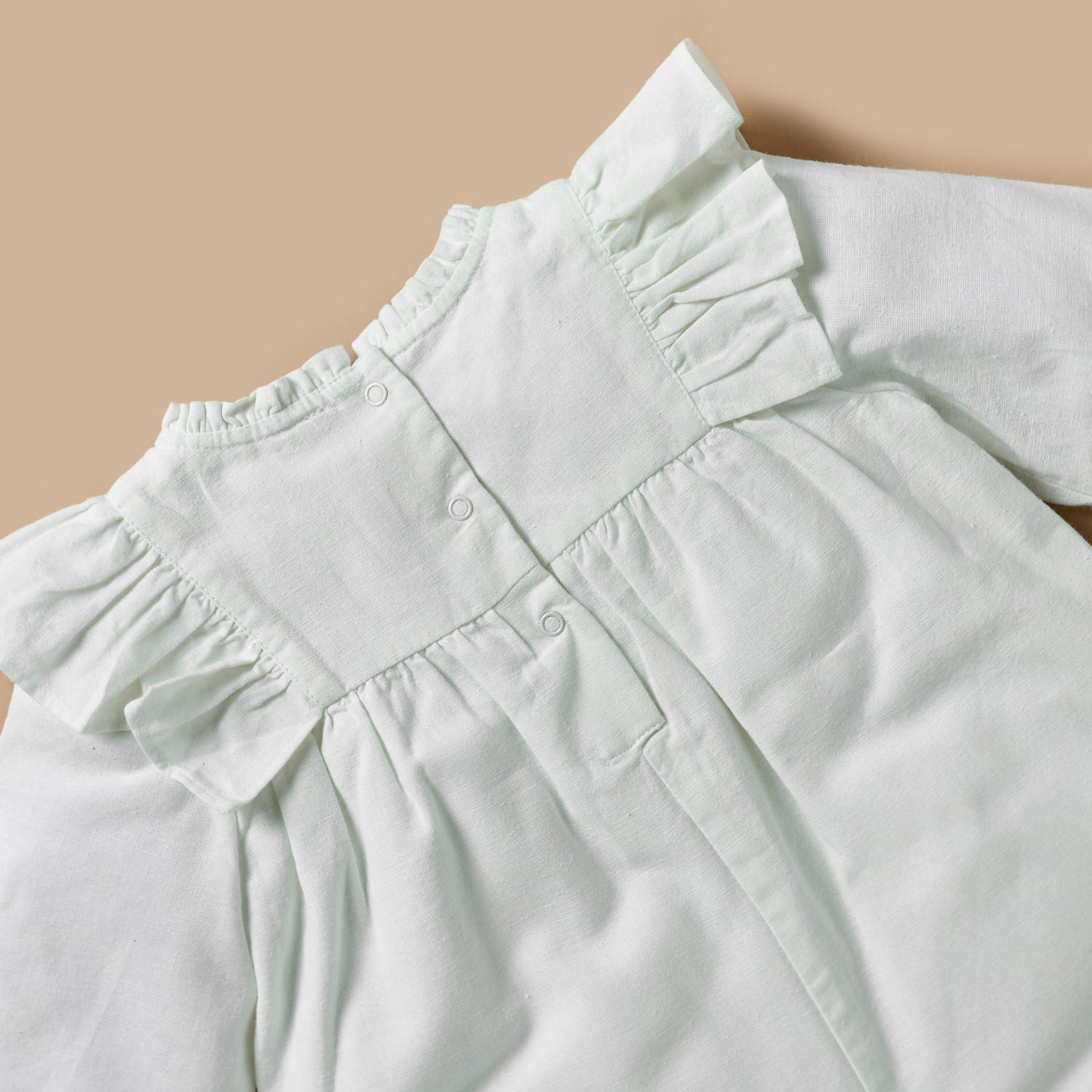 Giggles Textured Romper with Long Sleeves and Ruffle Detail