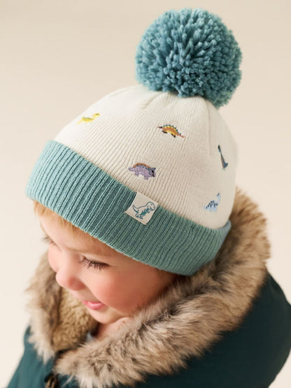 Ecru/Blue Dinosaur Embroidered Pom Beanie (3mths-10yrs) - Ecru/Blue Dinosaur / 12-18 Months (80-86cm)