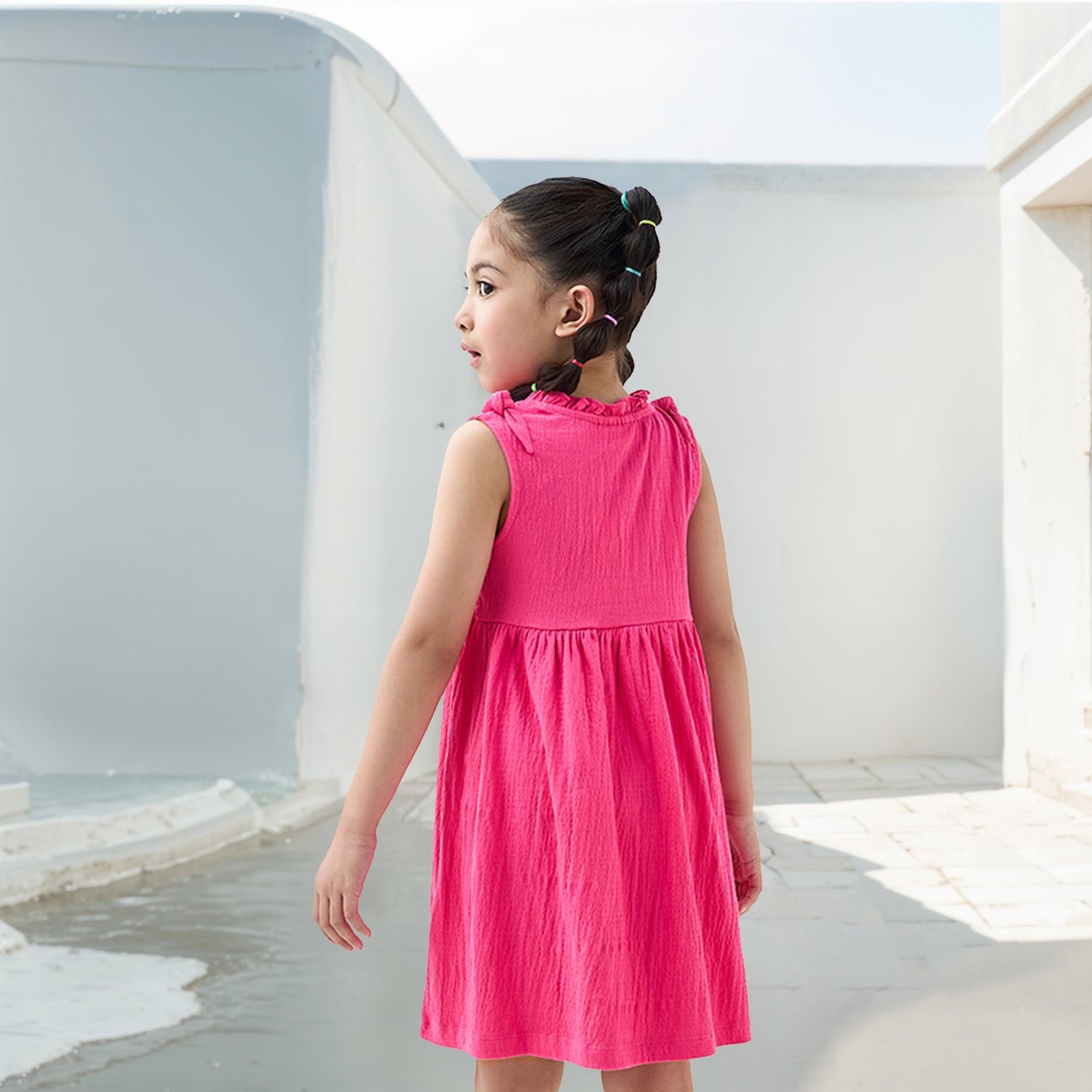 Juniors Textured Sleeveless Dress with Ruffle Trim and Bow Detail