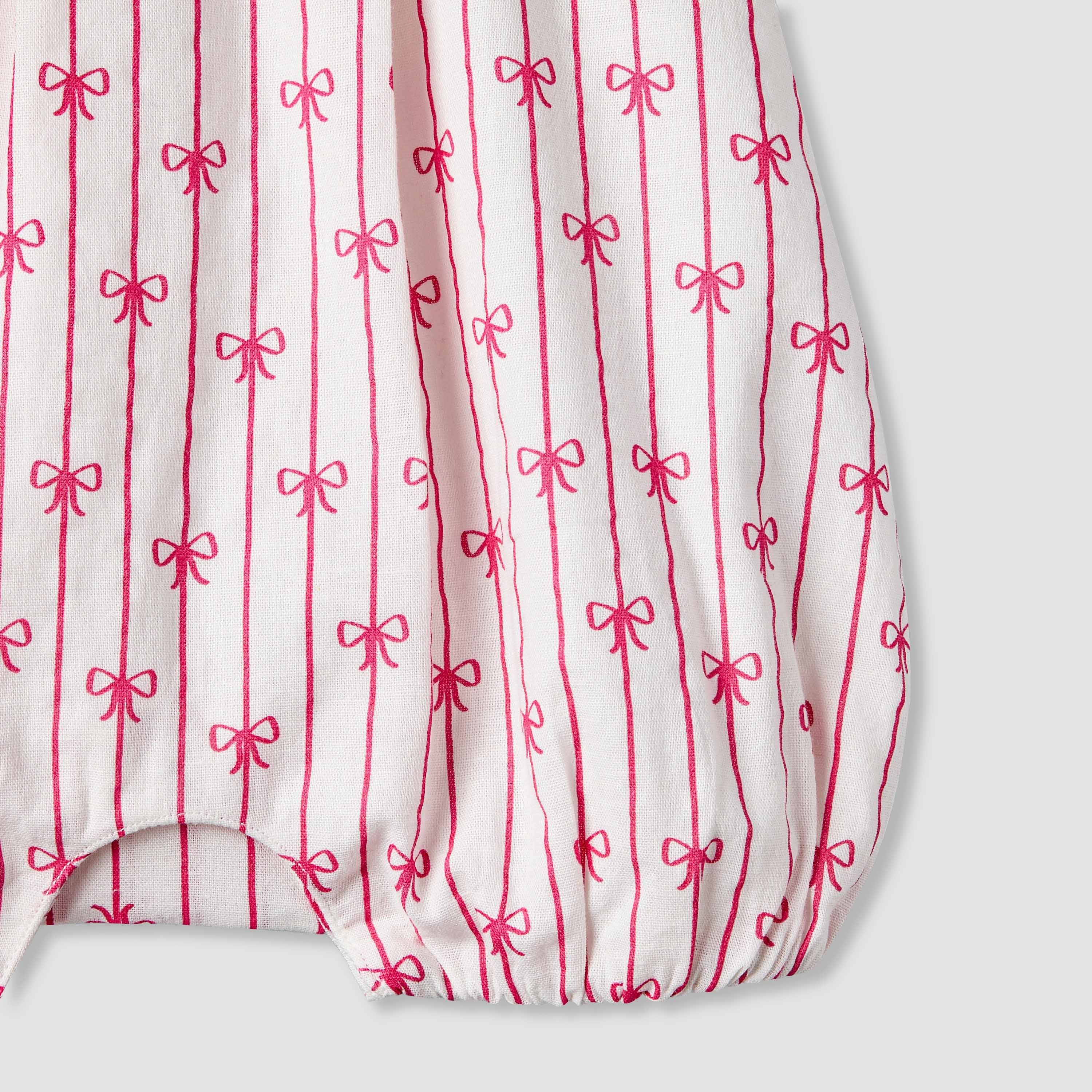 Juniors Peter Pan Collar Sleeveless Romper with Bow Print