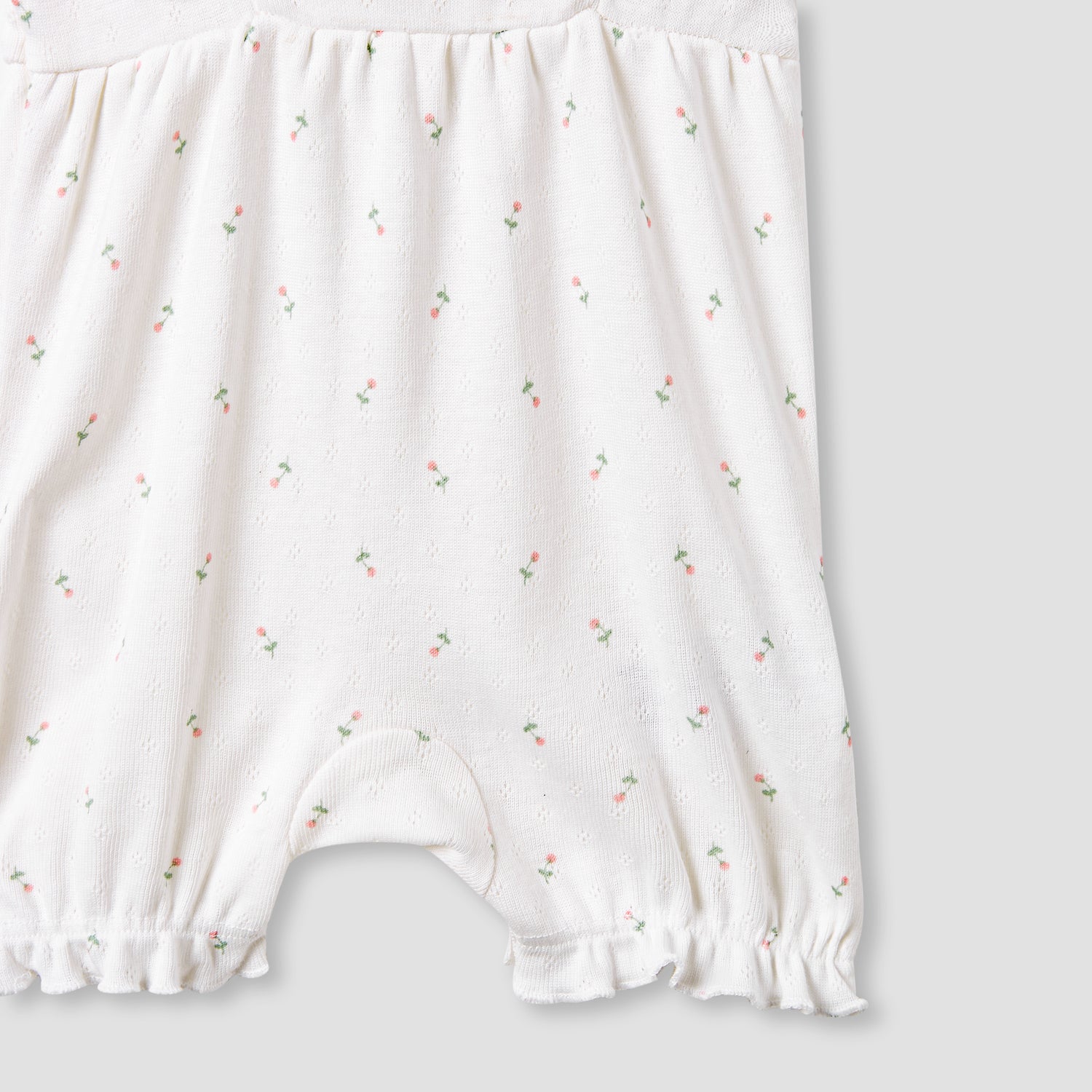 Juniors Printed Sleeveless Romper with Ruffle Accent