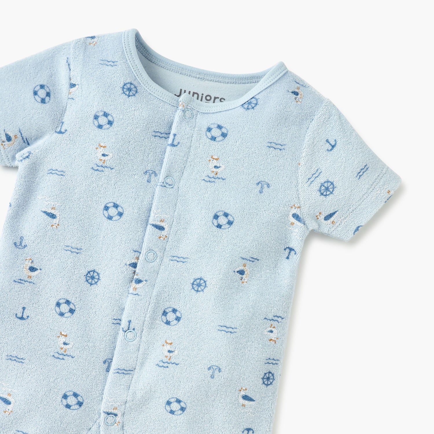 Juniors Graphic Print Romper with Short Sleeves and Button Closure